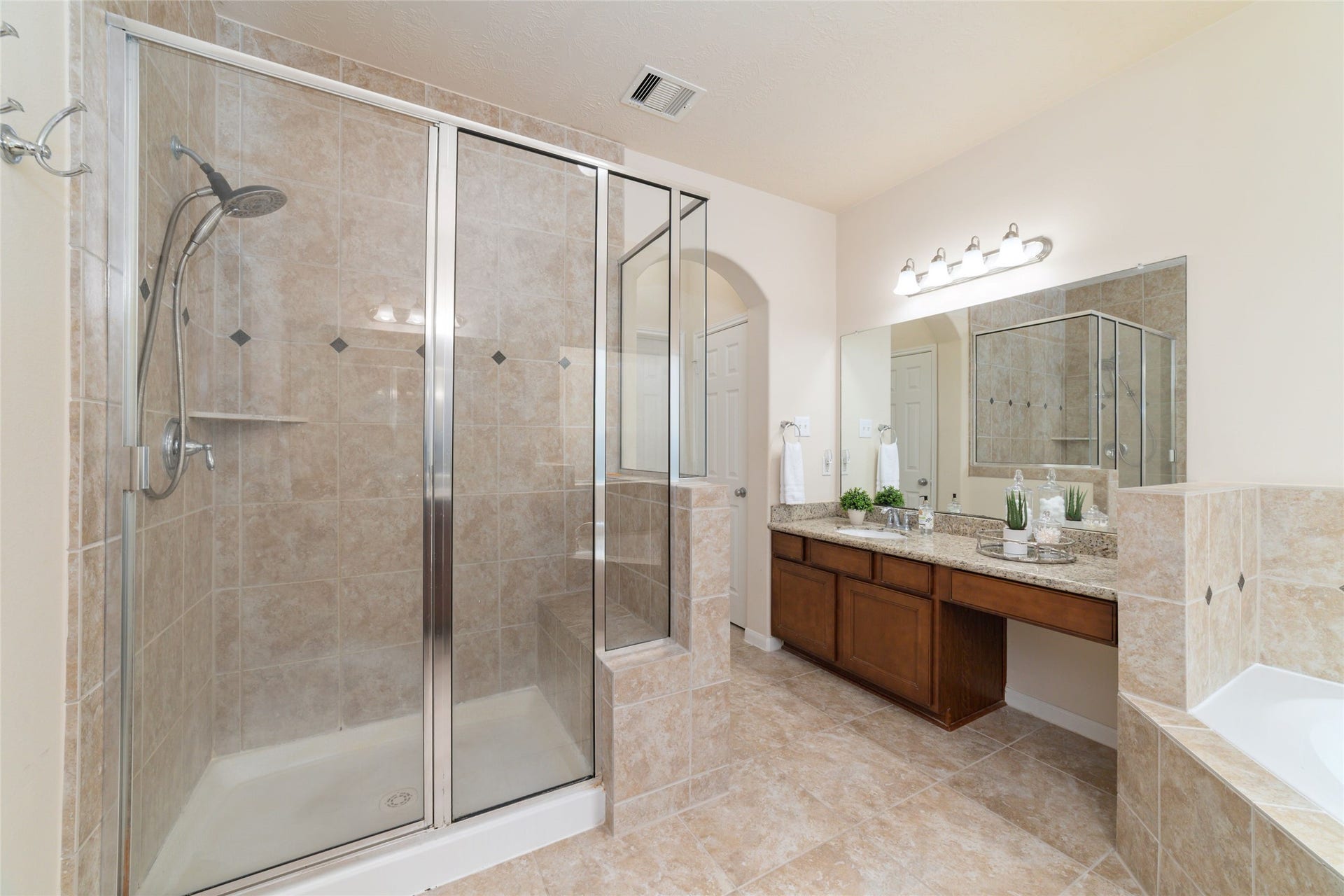 14422 Lakepointe Bend Lane, Cypress, TX 77429 The separate shower features a built in bench.