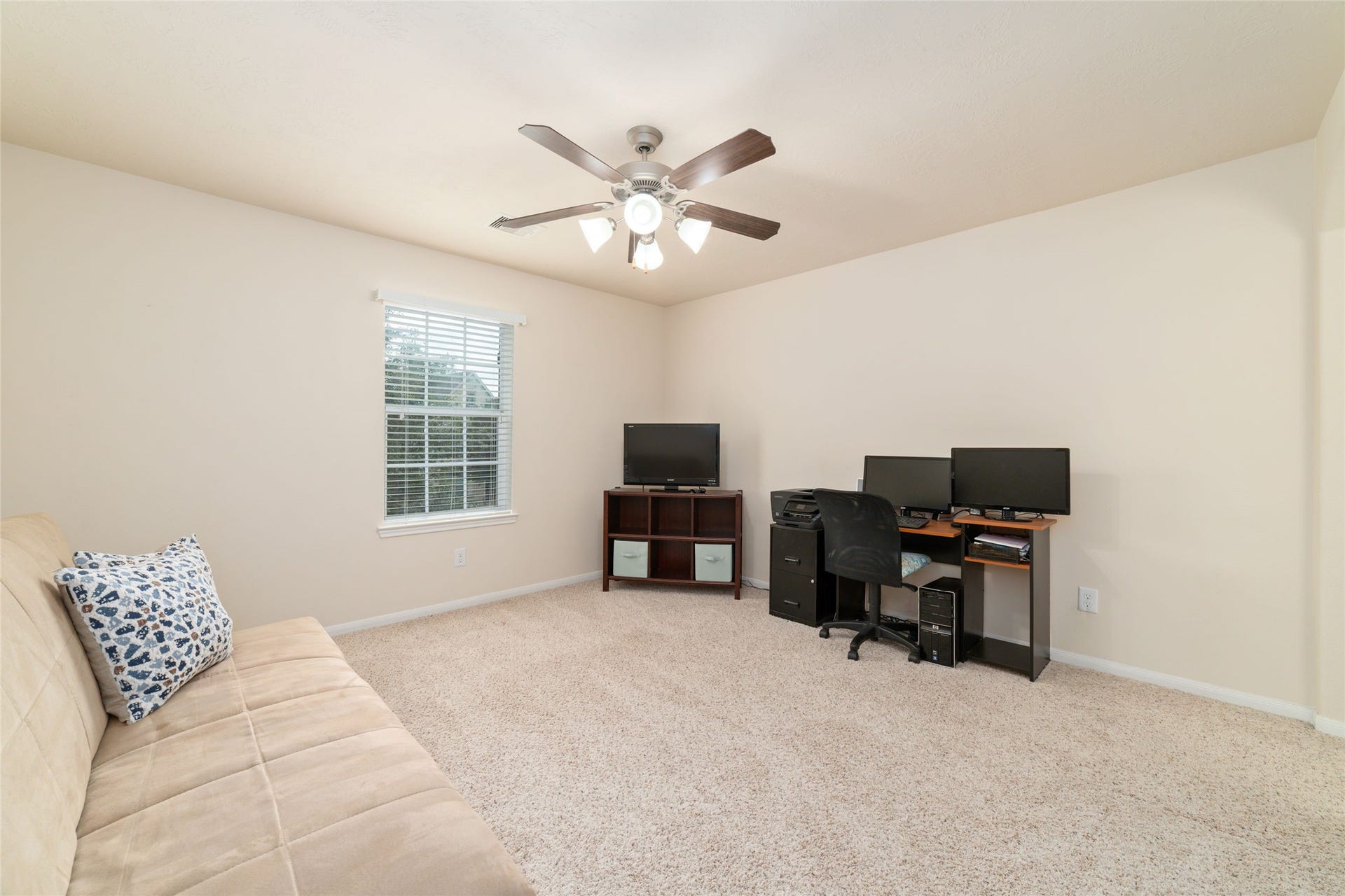 14422 Lakepointe Bend Lane, Cypress, TX 77429 This is the third of the four upstairs bedrooms currently being used as a hobby room.
