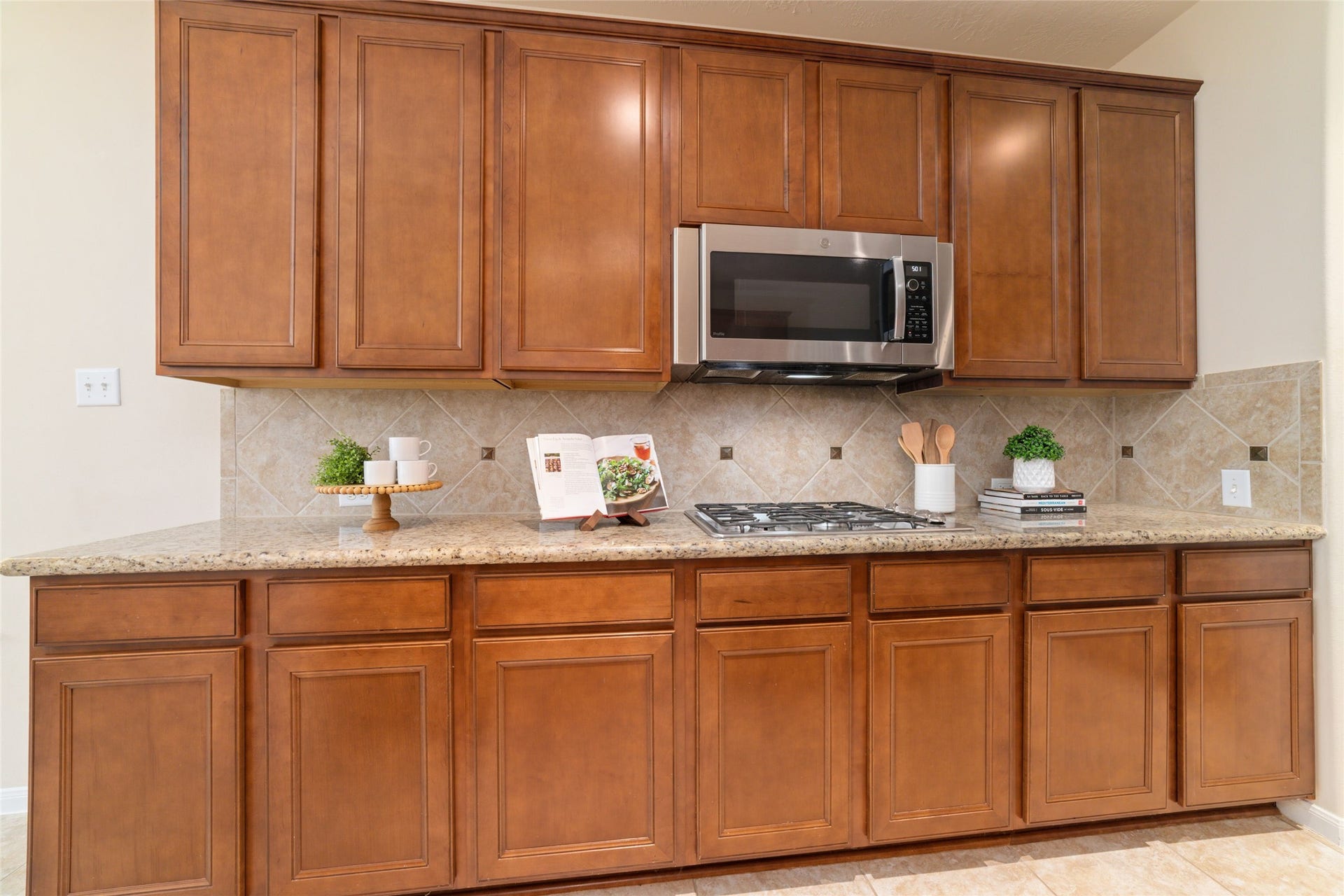 14422 Lakepointe Bend Lane, Cypress, TX 77429 Stainless steel appliances, including a gas cooktop.