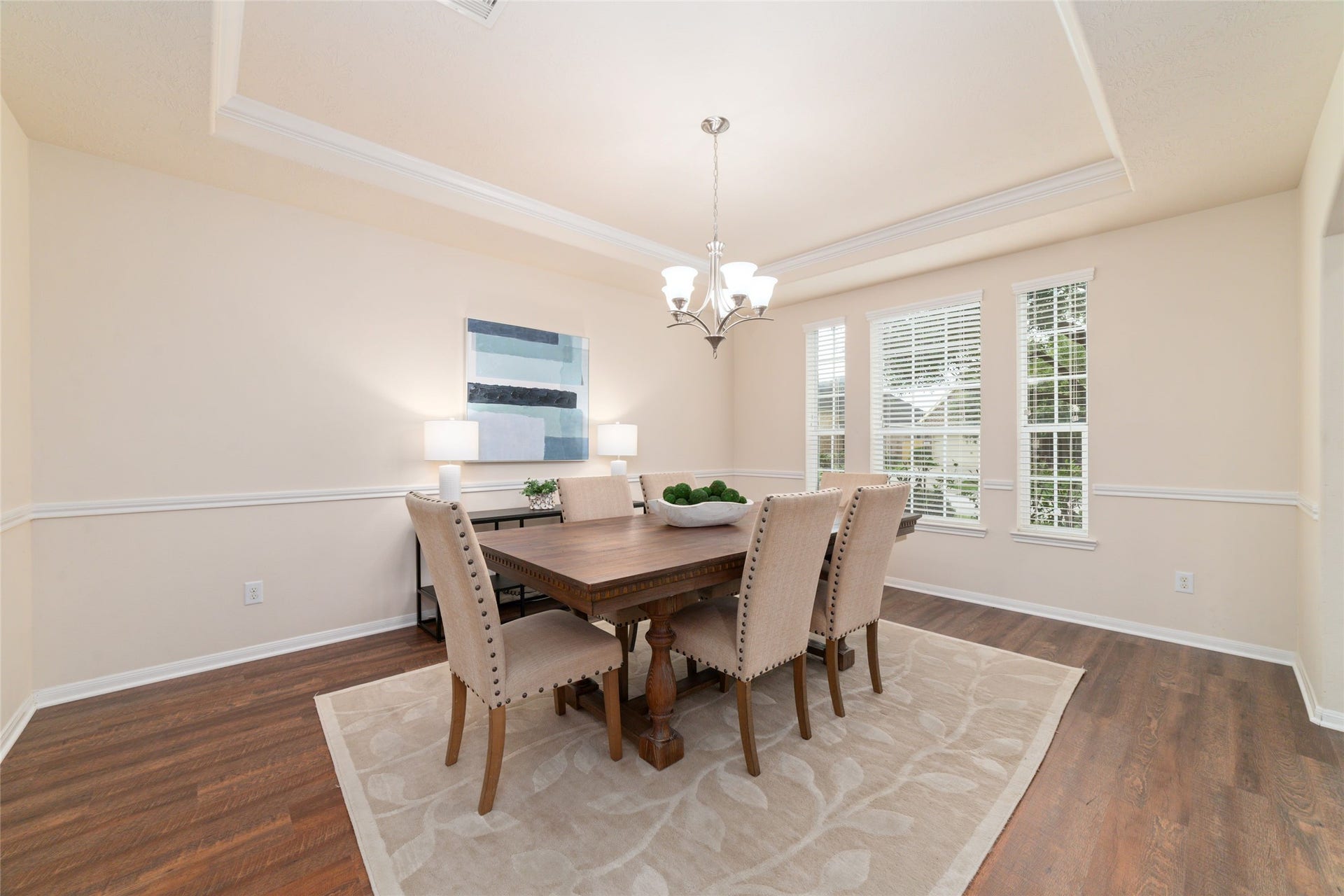 14422 Lakepointe Bend Lane, Cypress, TX 77429 Formal dining room with tray ceiling, crown molding and plenty of natural light perfect for hosting dinners and making memories.