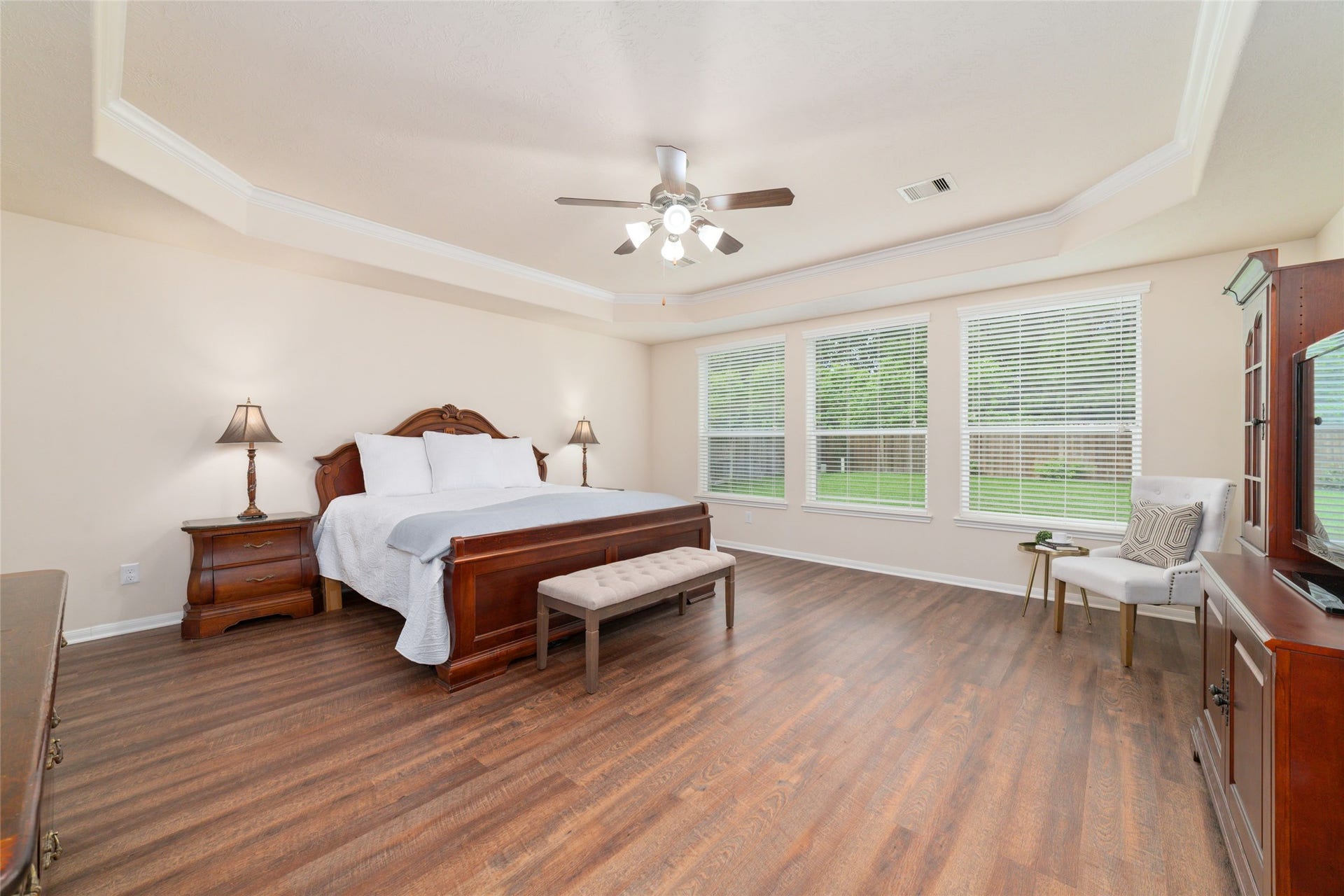 14422 Lakepointe Bend Lane, Cypress, TX 77429 The huge primary suite with tray ceiling, new wood flooring and plenty of natural light create an inviting space to recharge and relax