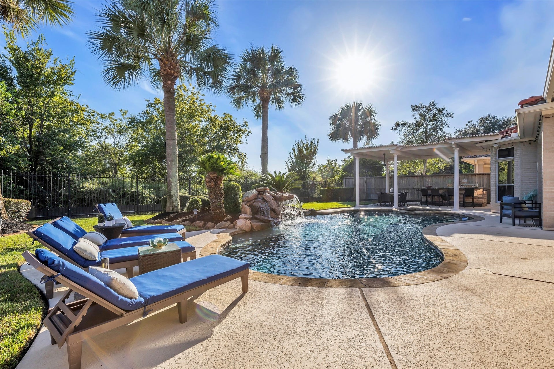19023 Windsor Lakes Drive, Houston, TX 77094 A backyard oasis, with a sparkling swimming pool and spa, an undercover patio, and a pergola. Backs onto George Bush Park, no back neighbors.