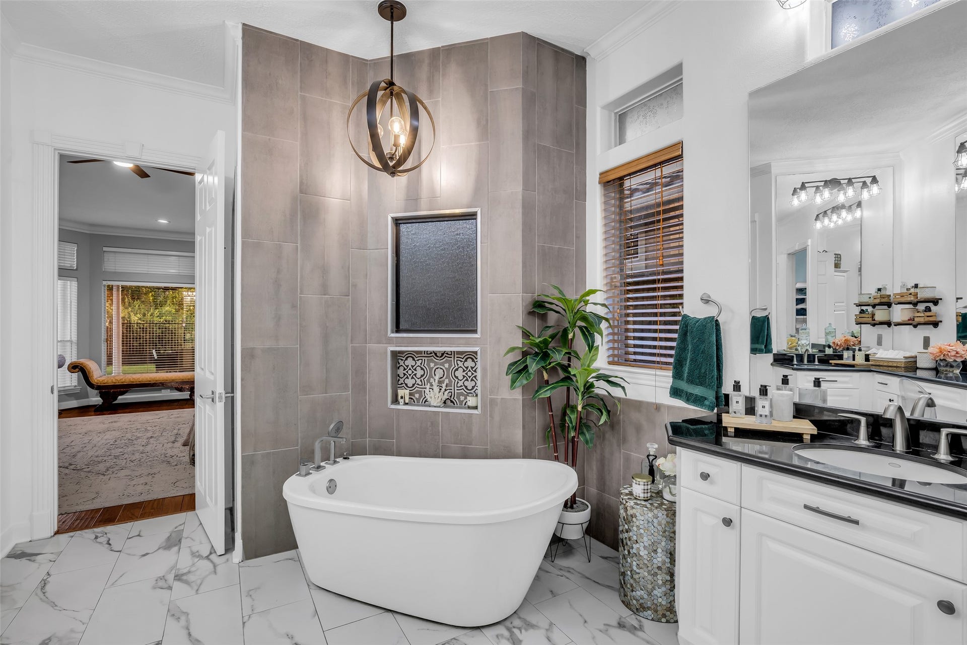 19023 Windsor Lakes Drive, Houston, TX 77094 The bathroom has been updated with a soaking tub and new tile in the walk-in shower located behind the tub.