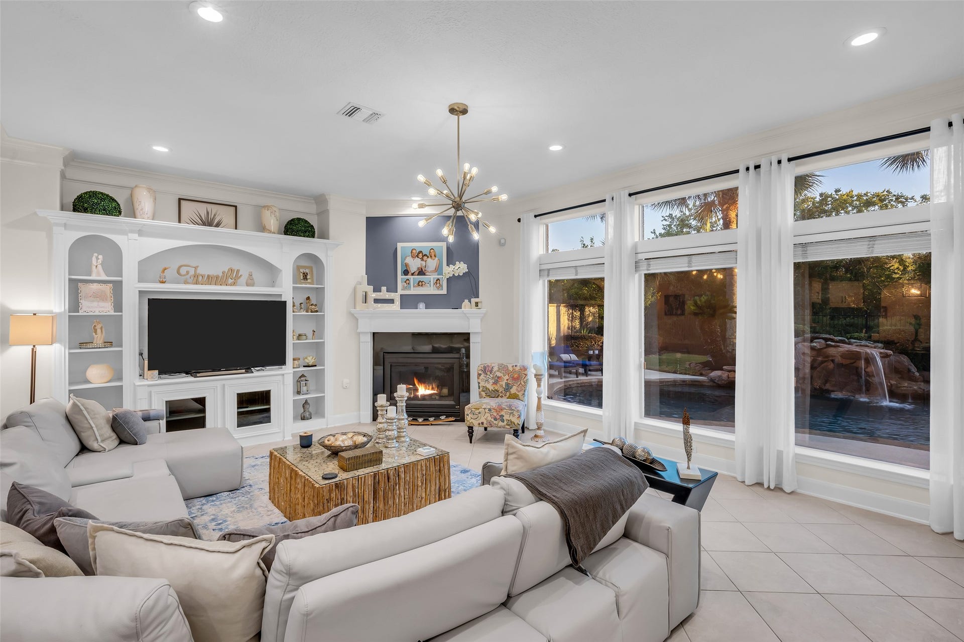 19023 Windsor Lakes Drive, Houston, TX 77094 The living area with a wall of windows overlooks the backyard and provides an abundance of natural light.