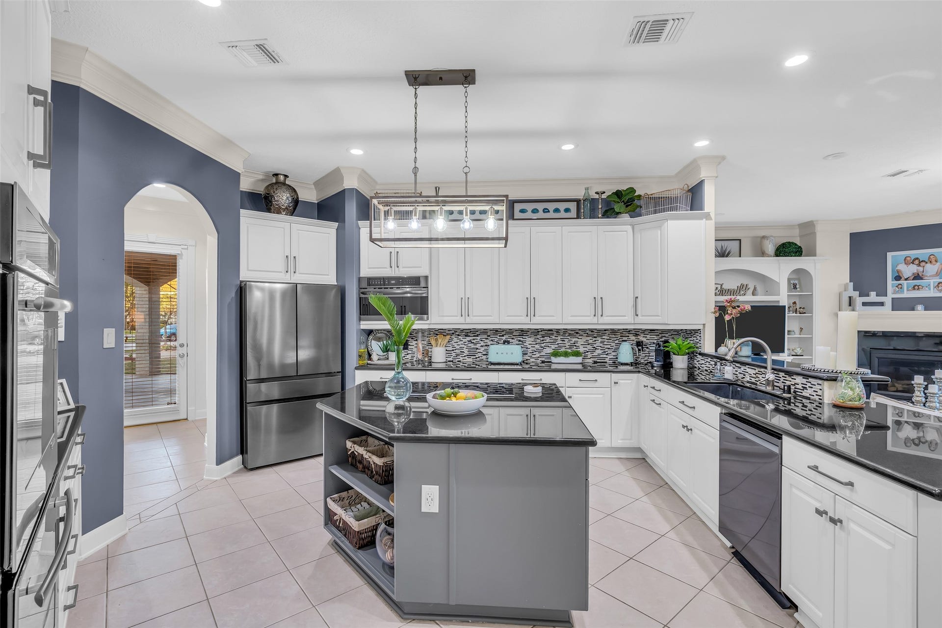 19023 Windsor Lakes Drive, Houston, TX 77094 There is an abundance of storage in the kitchen, and there is a walk-in pantry through the archway.