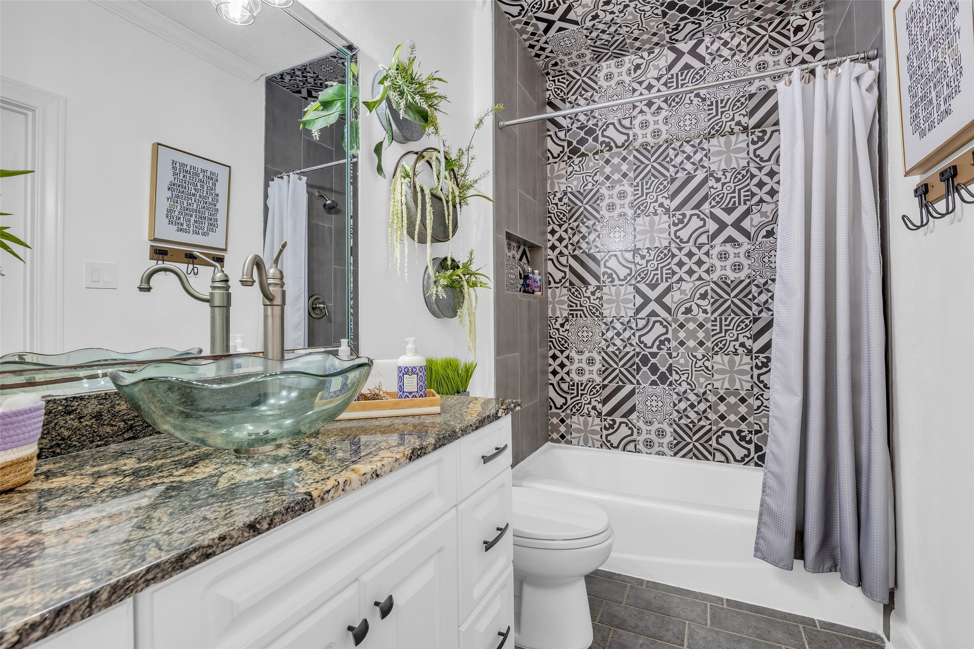 19023 Windsor Lakes Drive, Houston, TX 77094 The en-suite bathroom with updated tile to the ceiling.