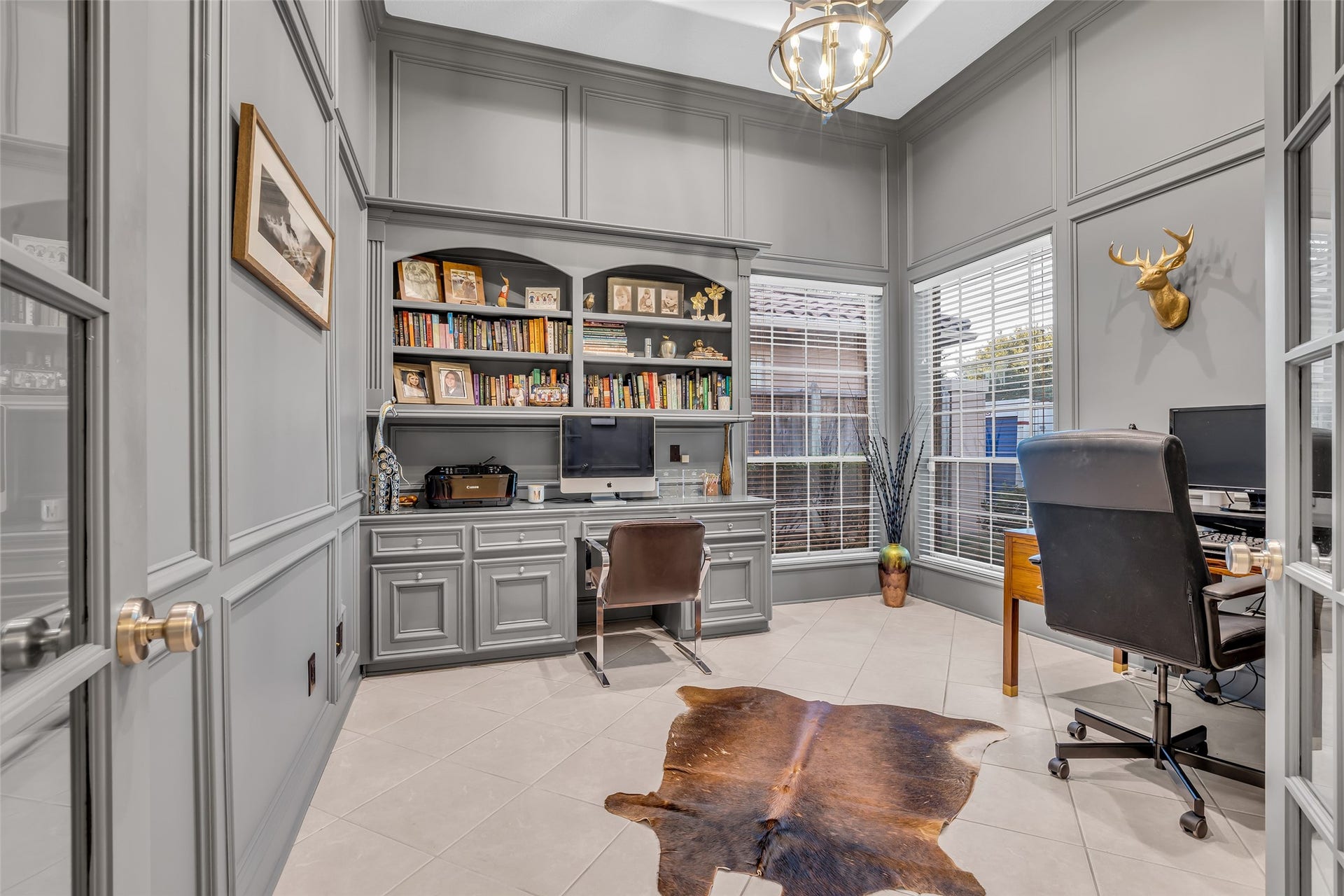 19023 Windsor Lakes Drive, Houston, TX 77094 The home office/study with wood paneling has French doors for extra privacy.