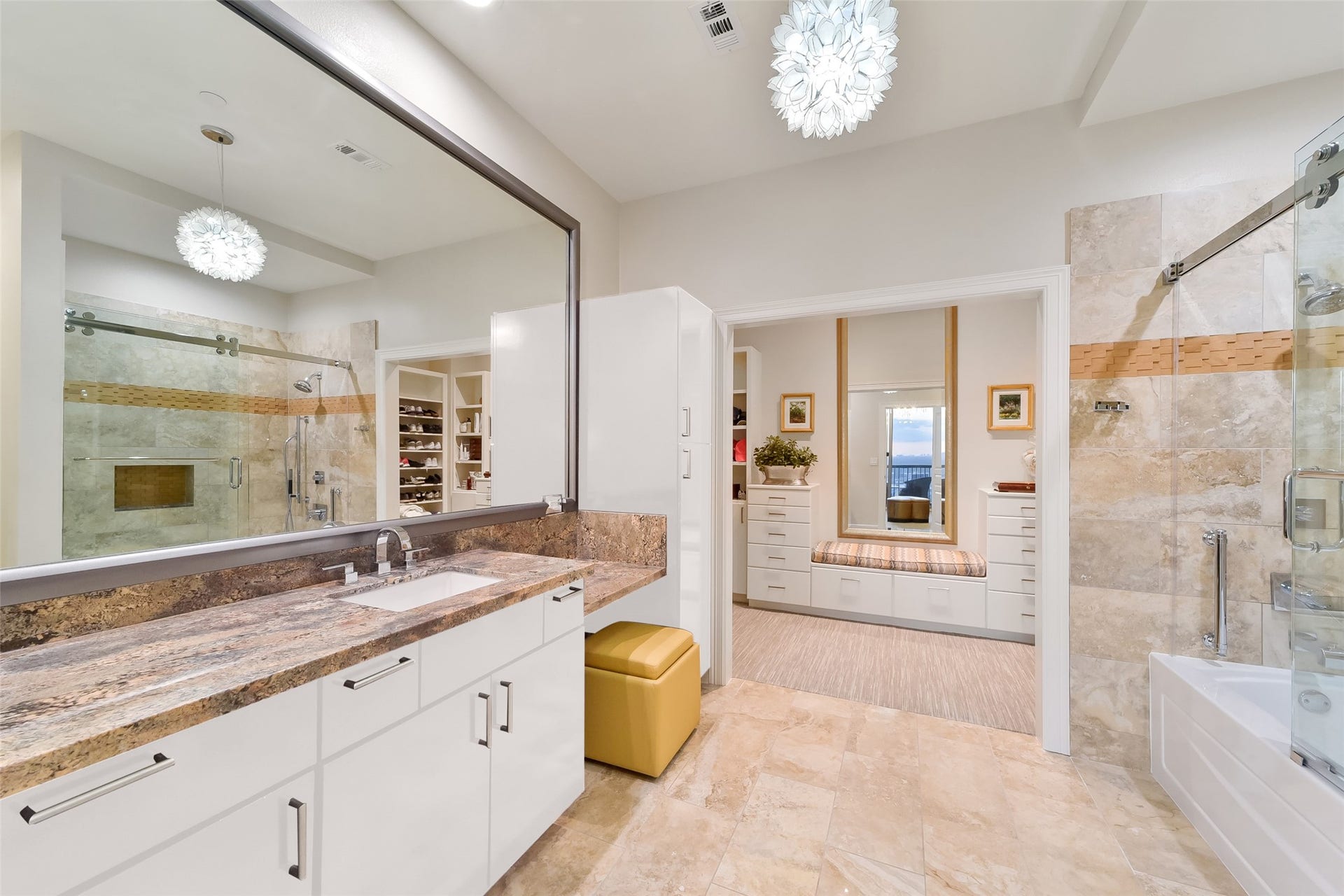 3333 Allen Parkway, #3003, Houston, TX 77019 One of two generously sized primary bathrooms, this one includes space for a seated vanity as well as a large tub and shower. This bathroom leads to one of two primary closets. The cabinets are virtually painted.