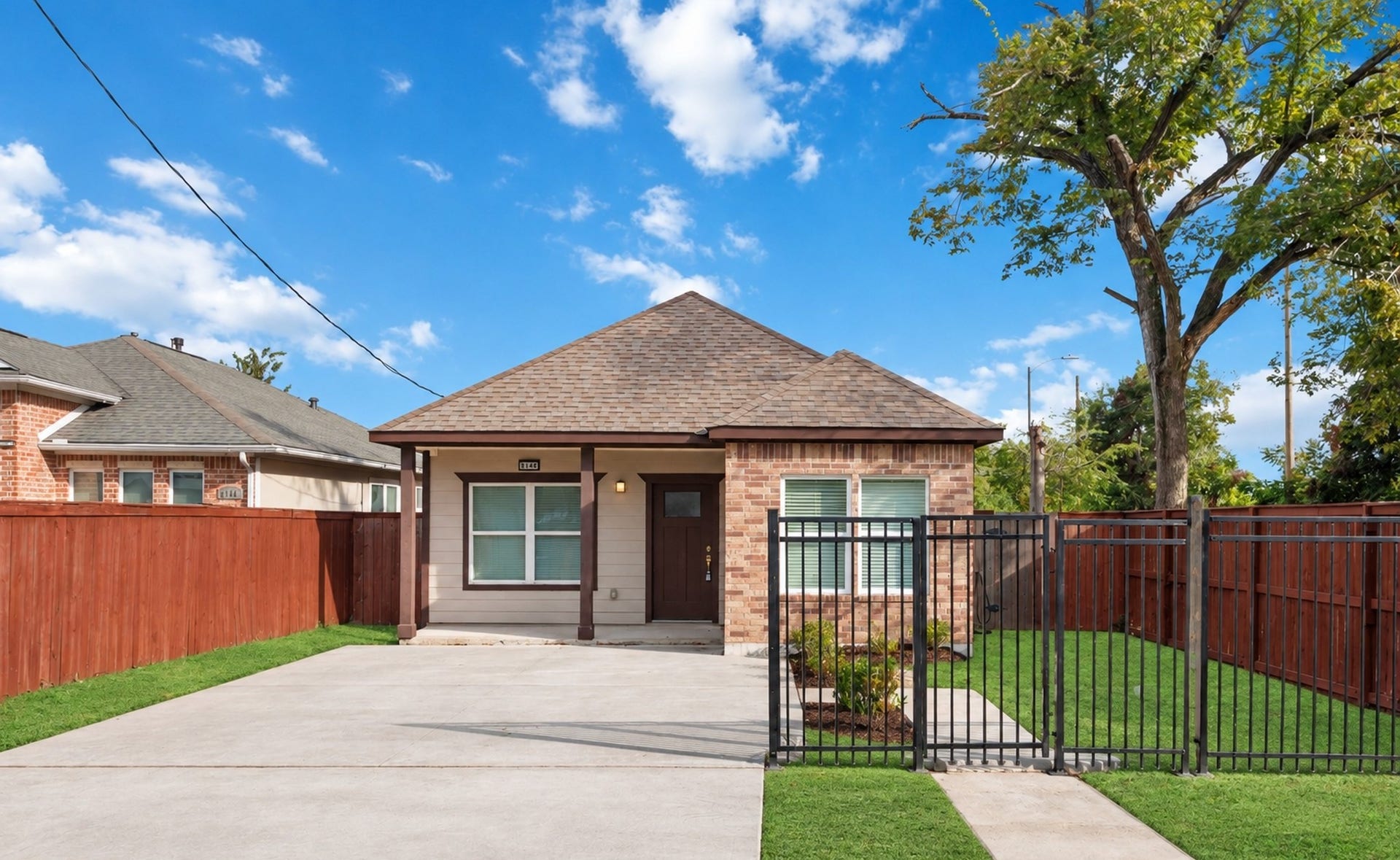 8147 Chateau Street, Houston, TX 77028 Front elevation with private driveway