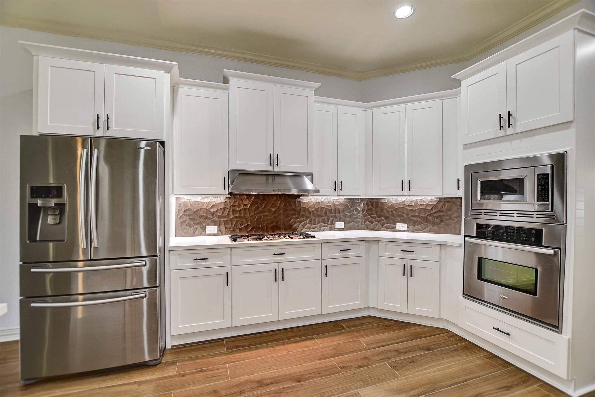 Gas stove and SS appliances throughout.