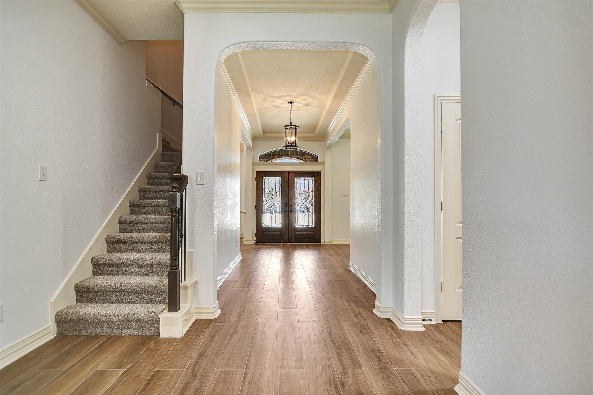 Long hallway before you arrive to the family room and kitchen.
