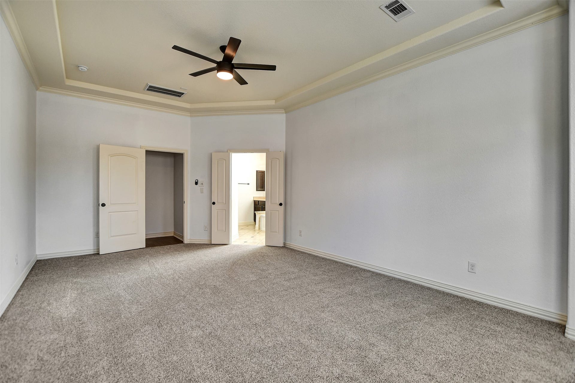 Another view of the primary bedroom.