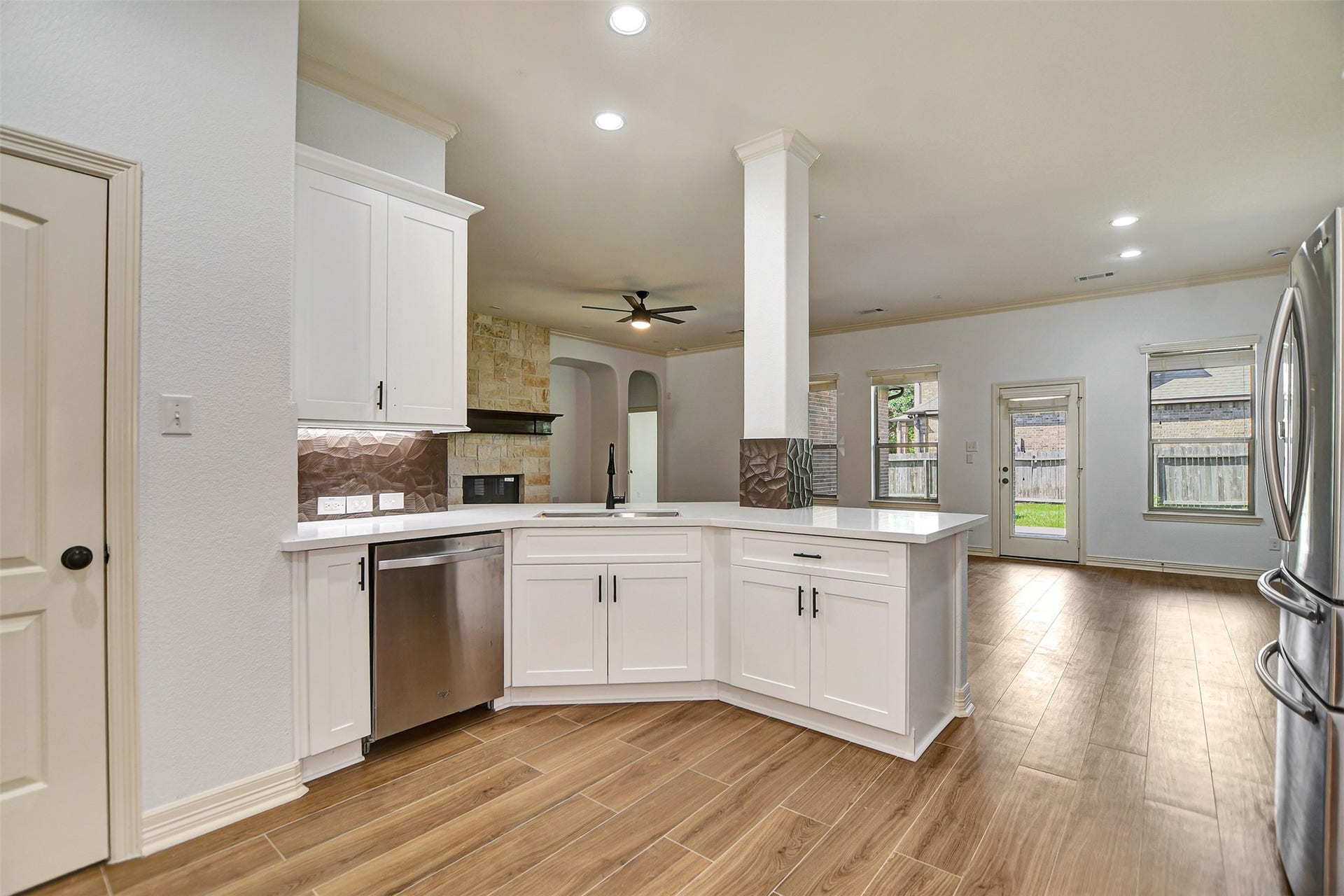 Kitchen opens to the breakfast and family room areas.
