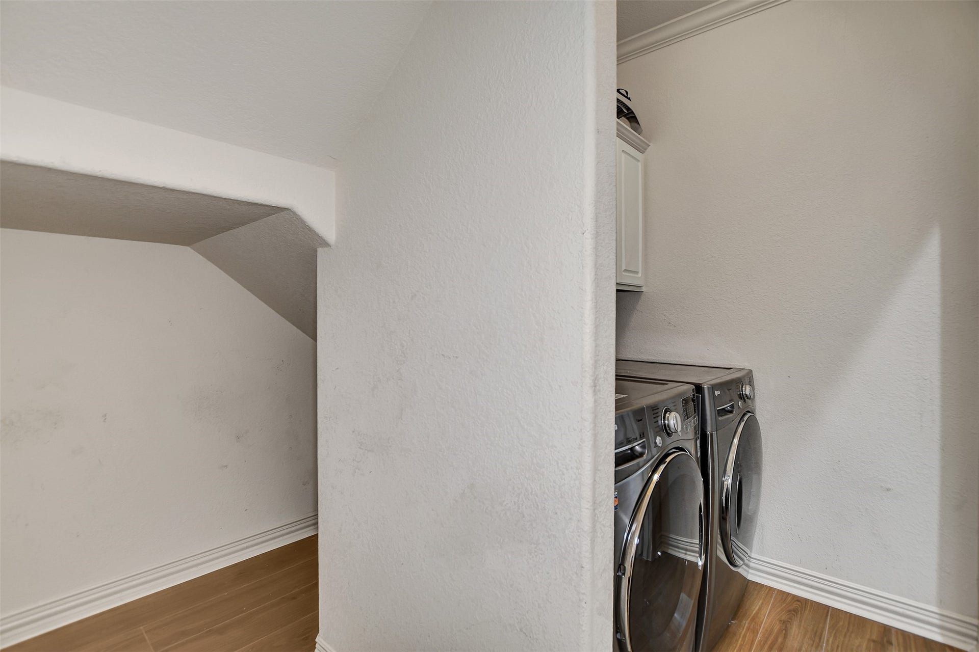 Large Laundry area with lots of storage space.