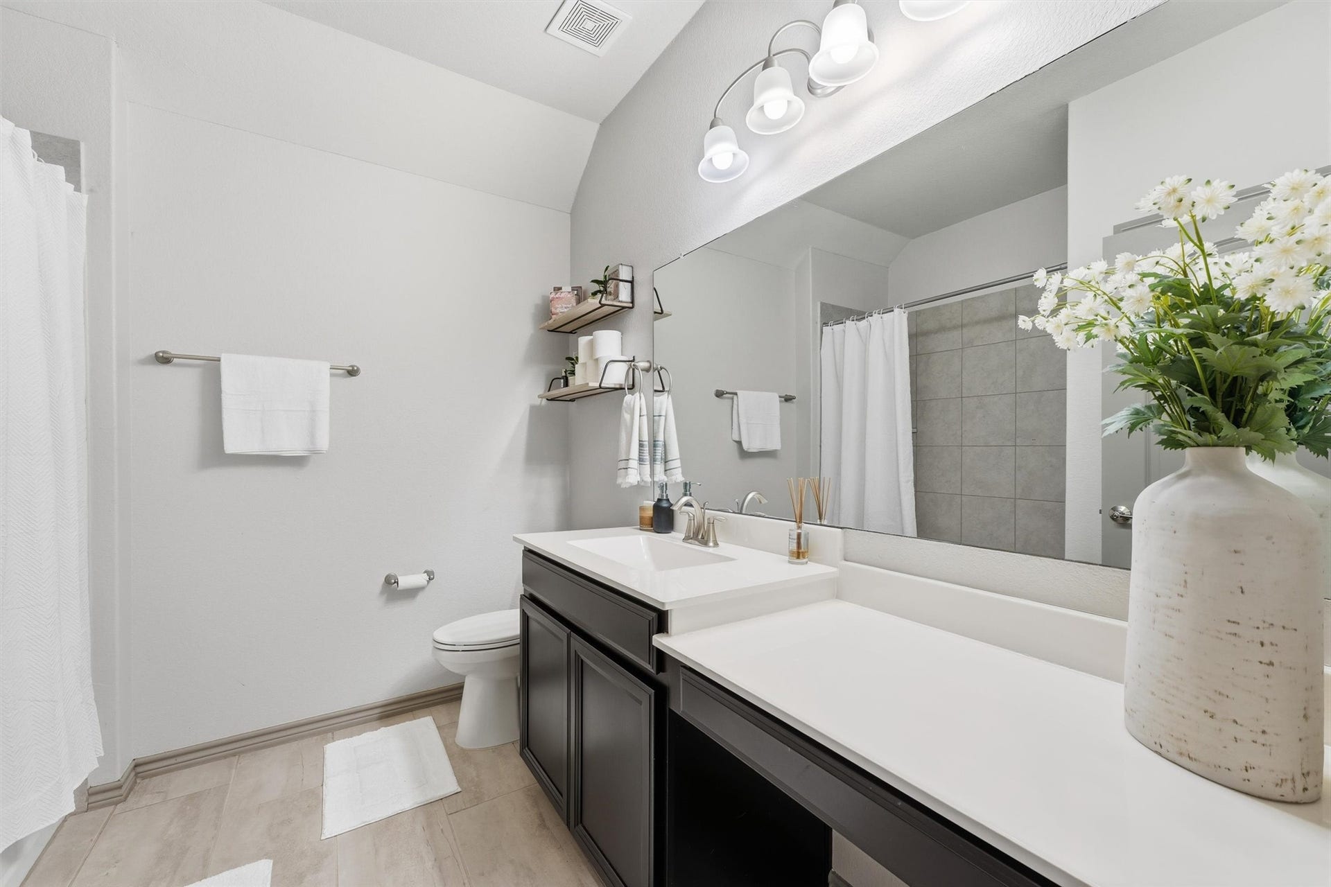 9726 Birdsnest Court, Spring, TX 77379 Well-appointed bathroom featuring a spacious vanity, contemporary fixtures, generous counter space, and neutral finishes.