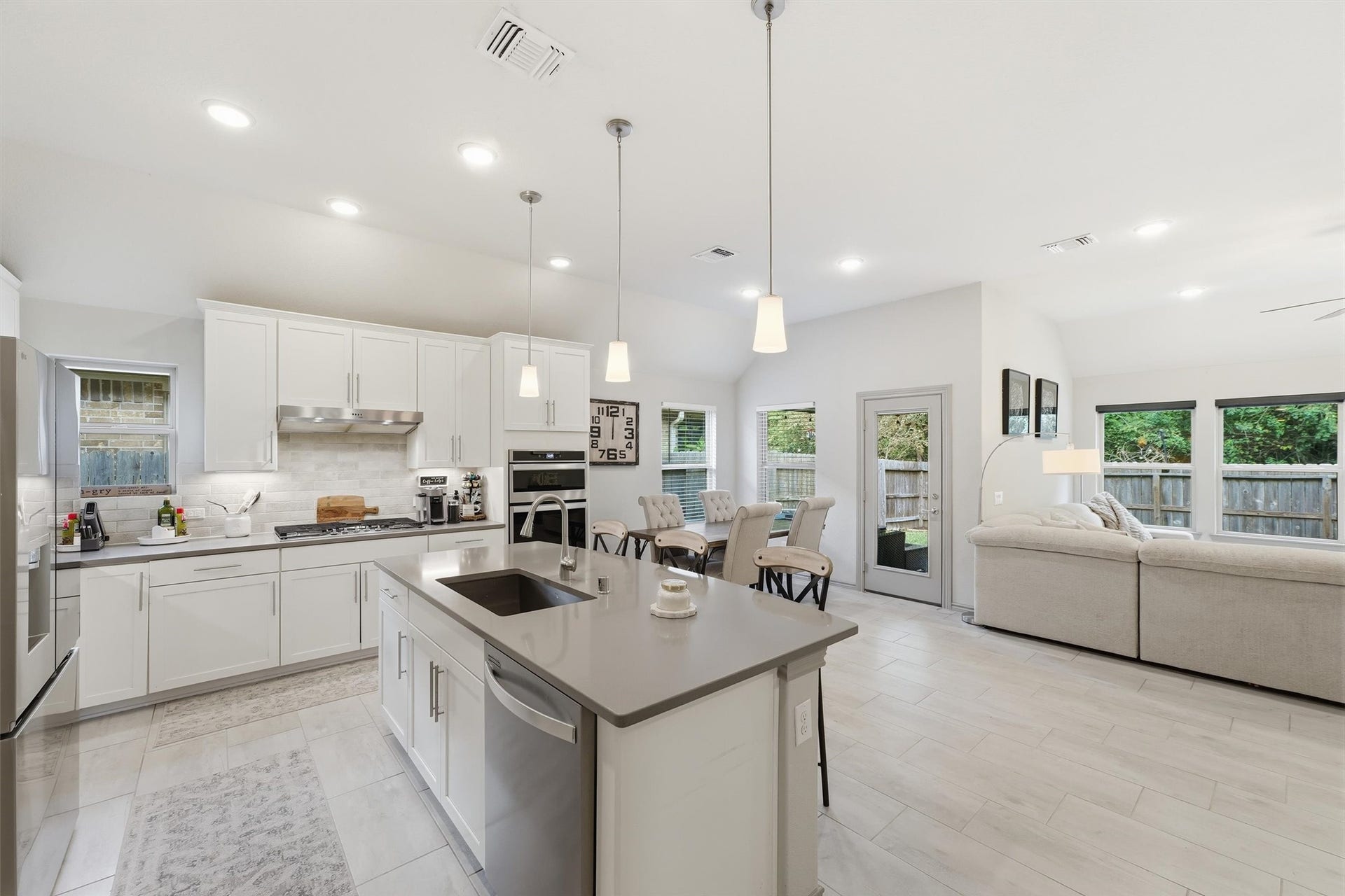 9726 Birdsnest Court, Spring, TX 77379 Expansive open-concept layout connecting the kitchen, dining, and living areas, perfect for everyday living and entertaining.