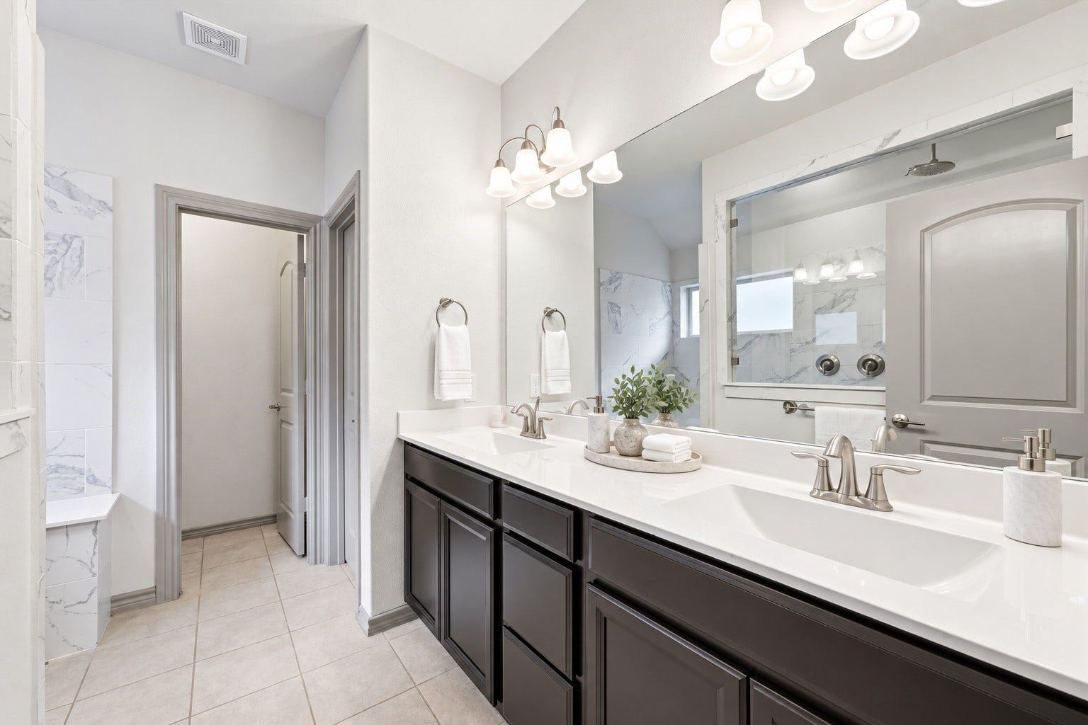 9726 Birdsnest Court, Spring, TX 77379 Virtually staged Countertop accessories, towels, and plants were digitally added.