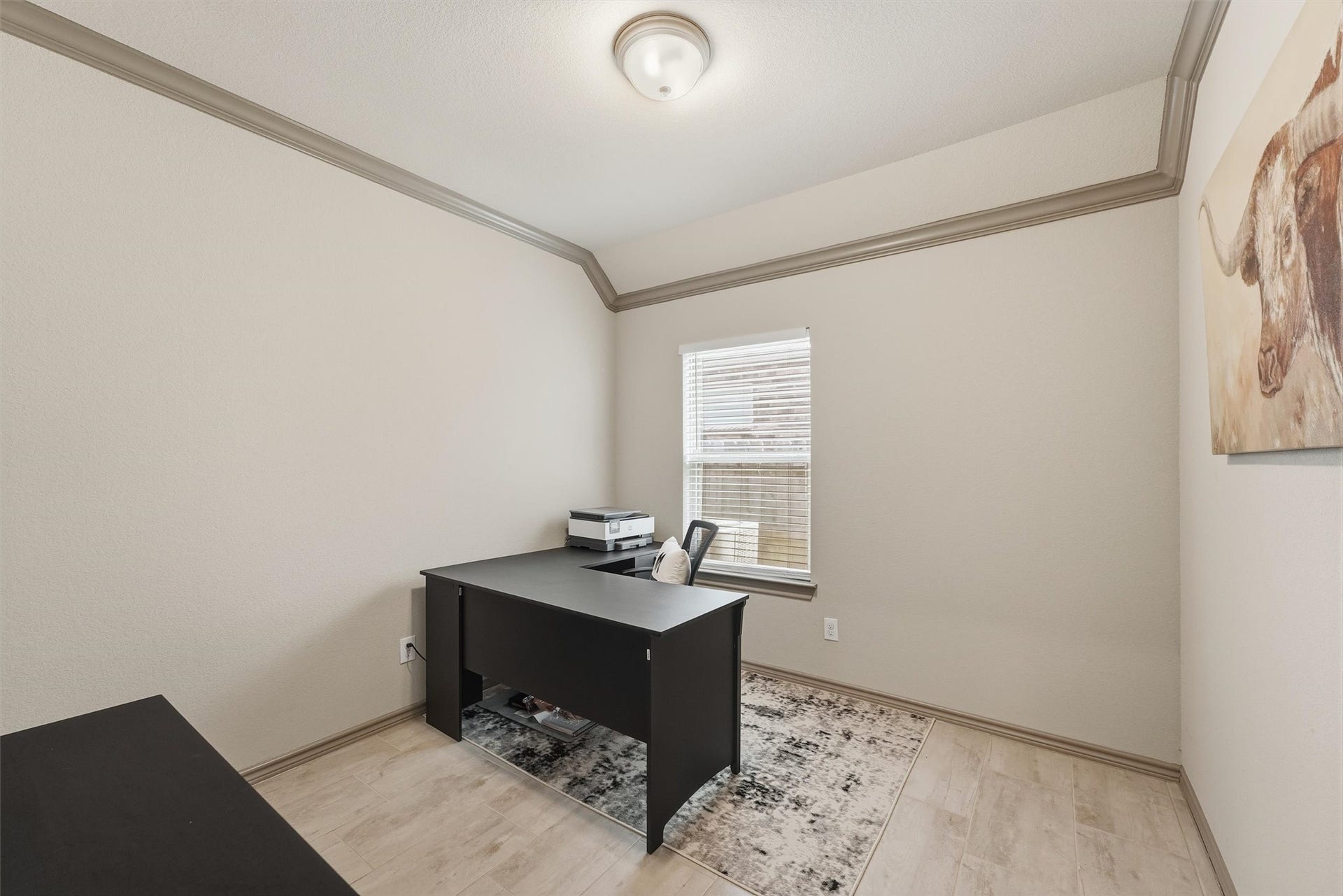 9726 Birdsnest Court, Spring, TX 77379 Private home office with an executive-style desk, natural light, and a neutral color palette, ideal for working from home.