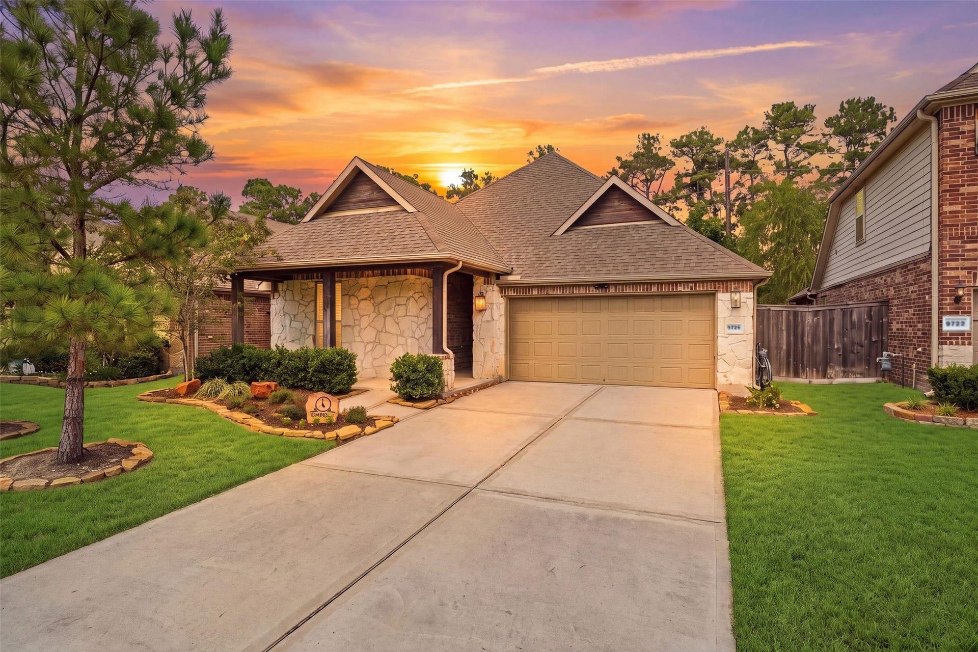 9726 Birdsnest Court, Spring, TX 77379 Stunning twilight view showcasing the home's attractive exterior, inviting entryway, and beautifully landscaped front yard.