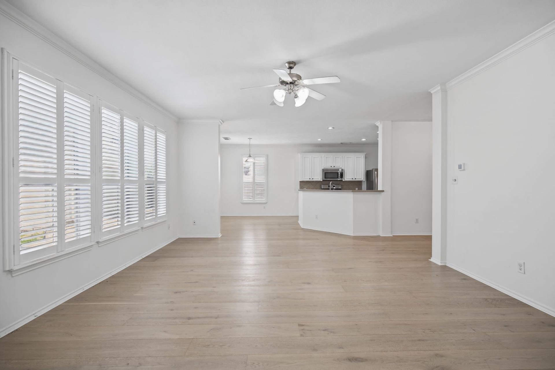 The reverse view highlights the easy flow between the living room and kitchen.