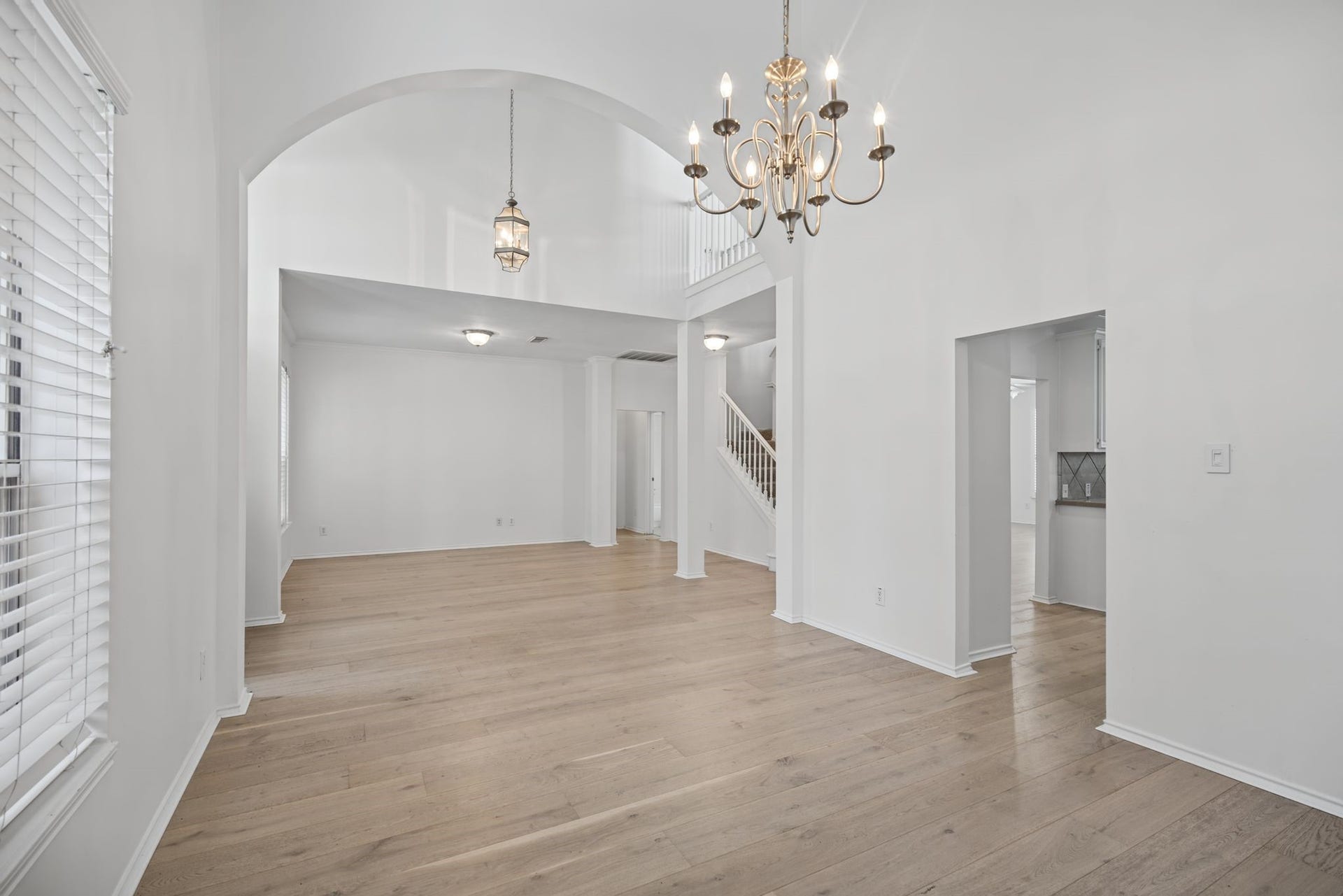 Continue into the dining room, where a chandelier and broad archway lend definition and a sense of occasion to the space.