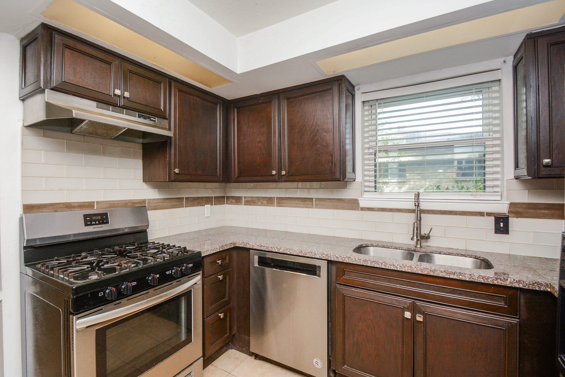 Granite kitchen countertops + Stainless Steel applicances