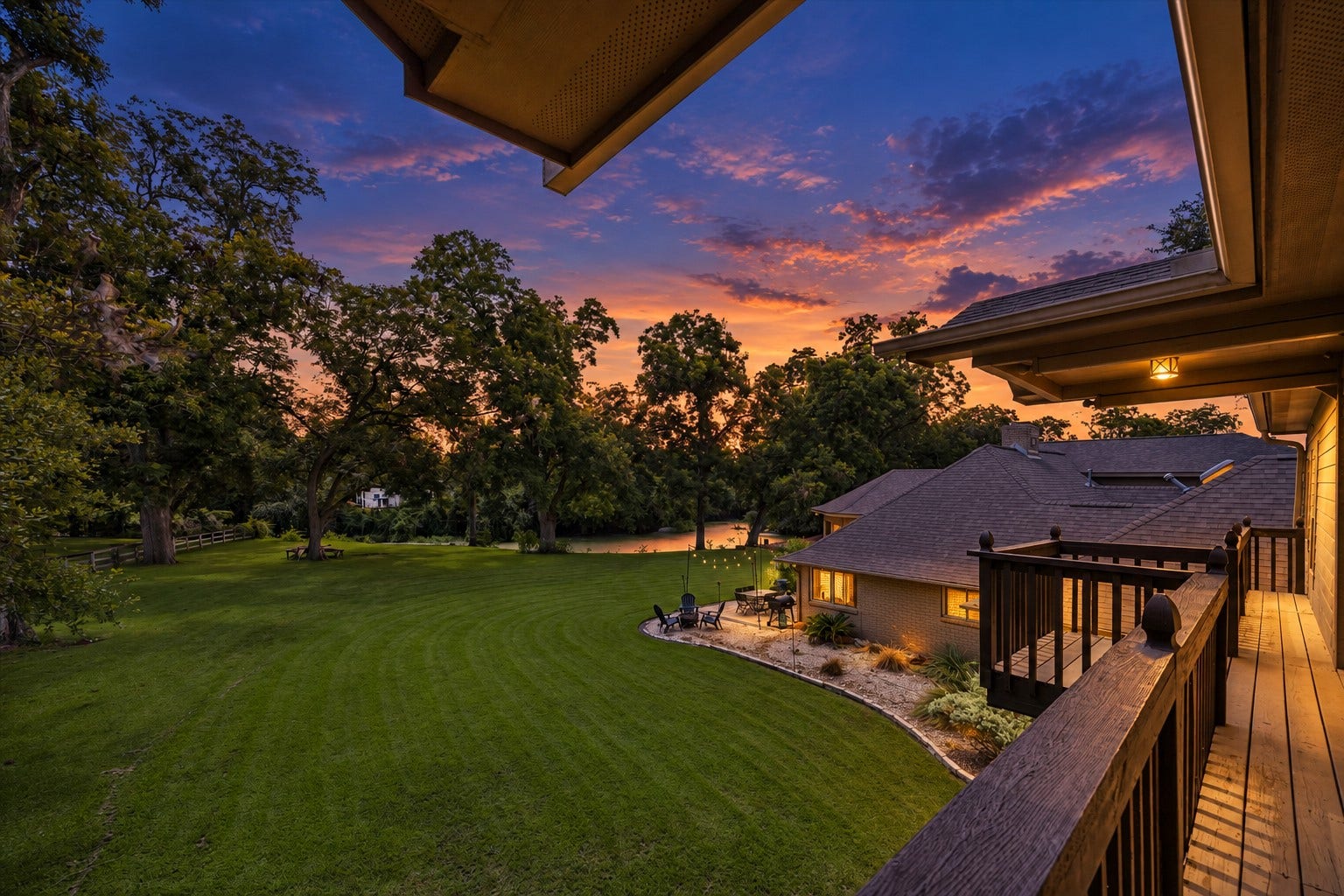 2020 PECAN LAKE DRIVE, Richmond, TX 77406 ELEVATED BALCONY OVERLOOKS THE EXPANSIVE BACKYARD, MATURE TREES, AND SURROUNDING GREEN SPACE.