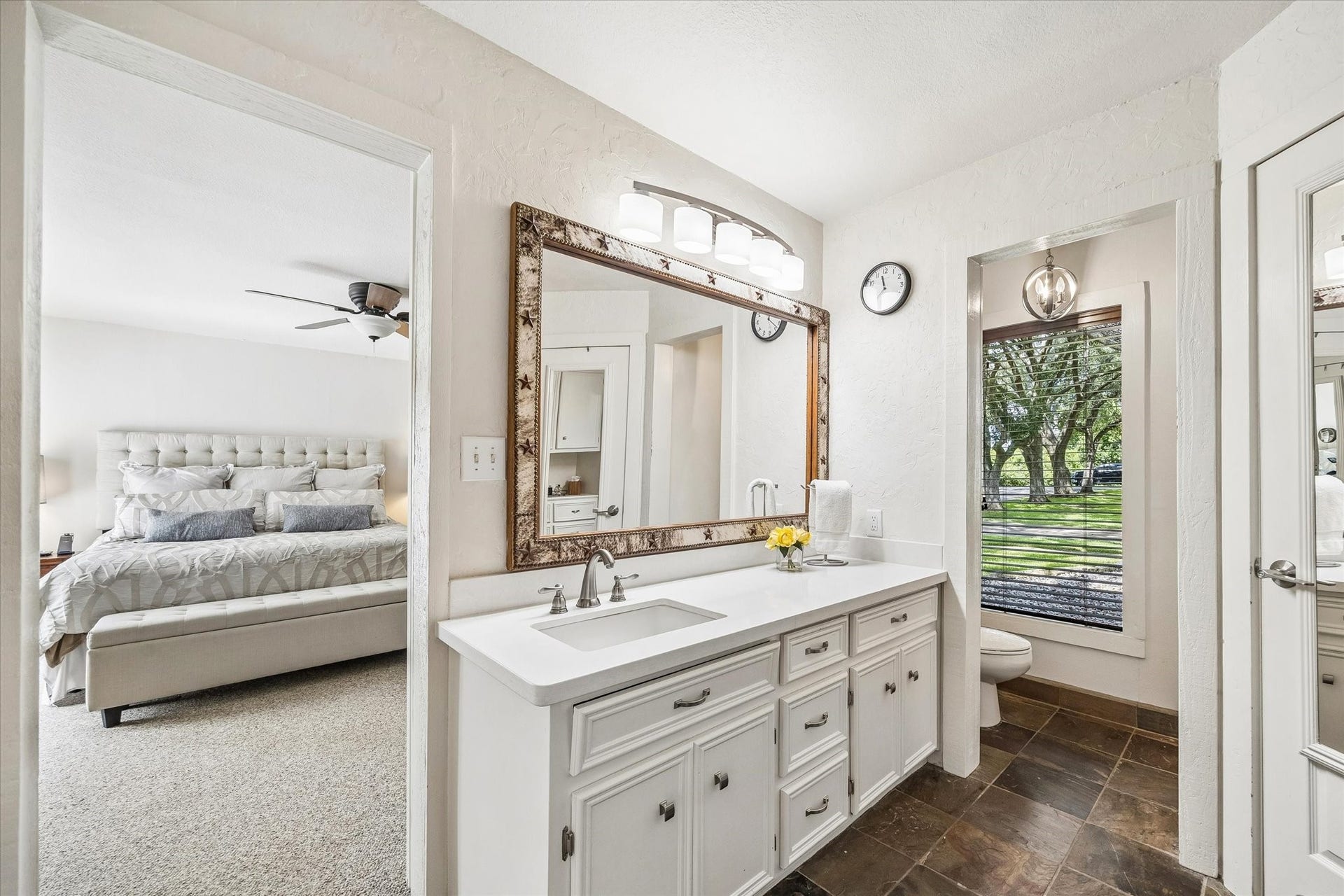 2020 PECAN LAKE DRIVE, Richmond, TX 77406 PRIMARY BATHROOM INCLUDES A LARGE VANITY, AMPLE CABINET STORAGE, TILE FLOORING, AND DIRECT ACCESS TO THE PRIMARY BEDROOM.