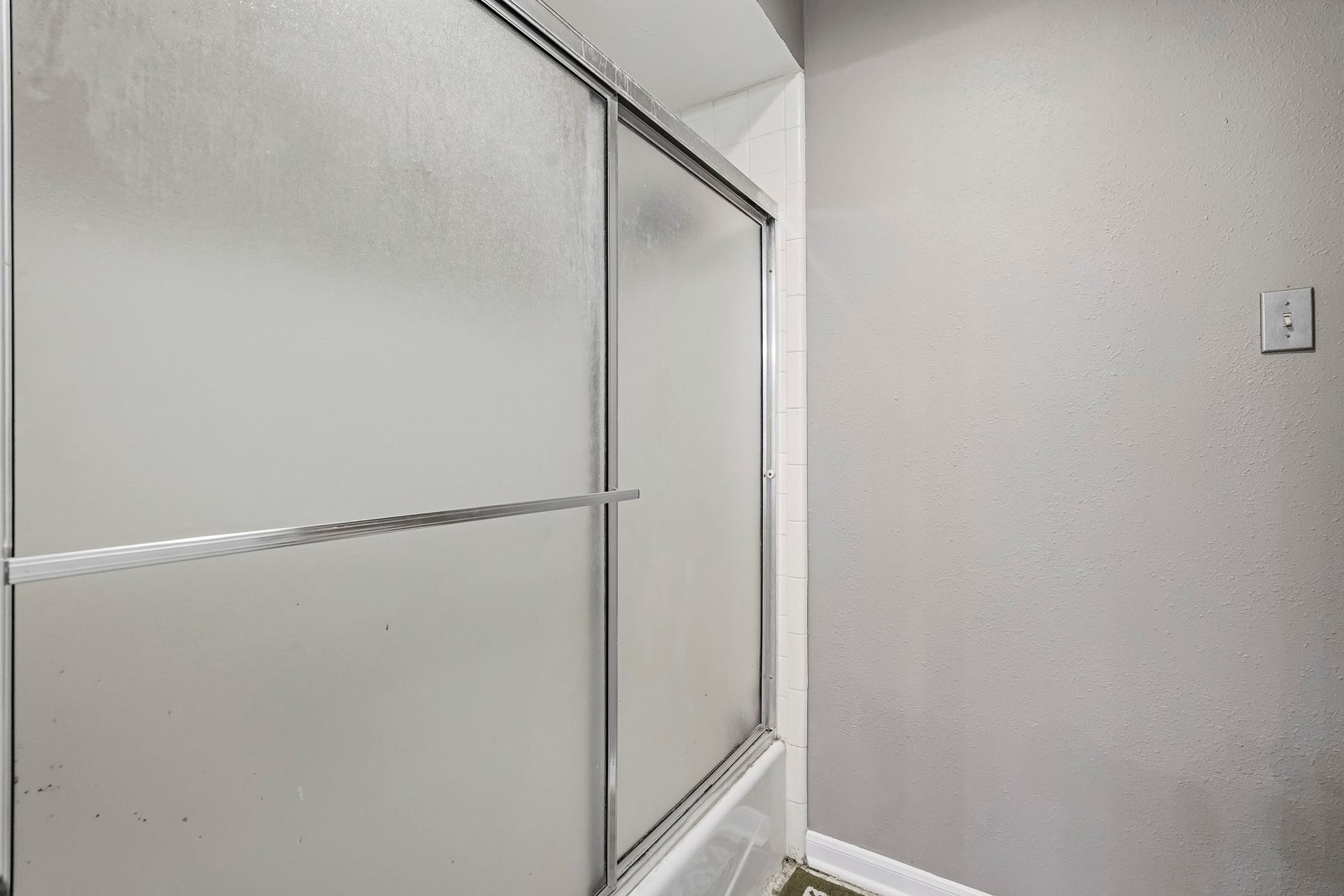 3610 Valley Haven Drive, Houston, TX 77339 Glass-enclosed shower with a clean, neutral color palette for a fresh and inviting atmosphere.