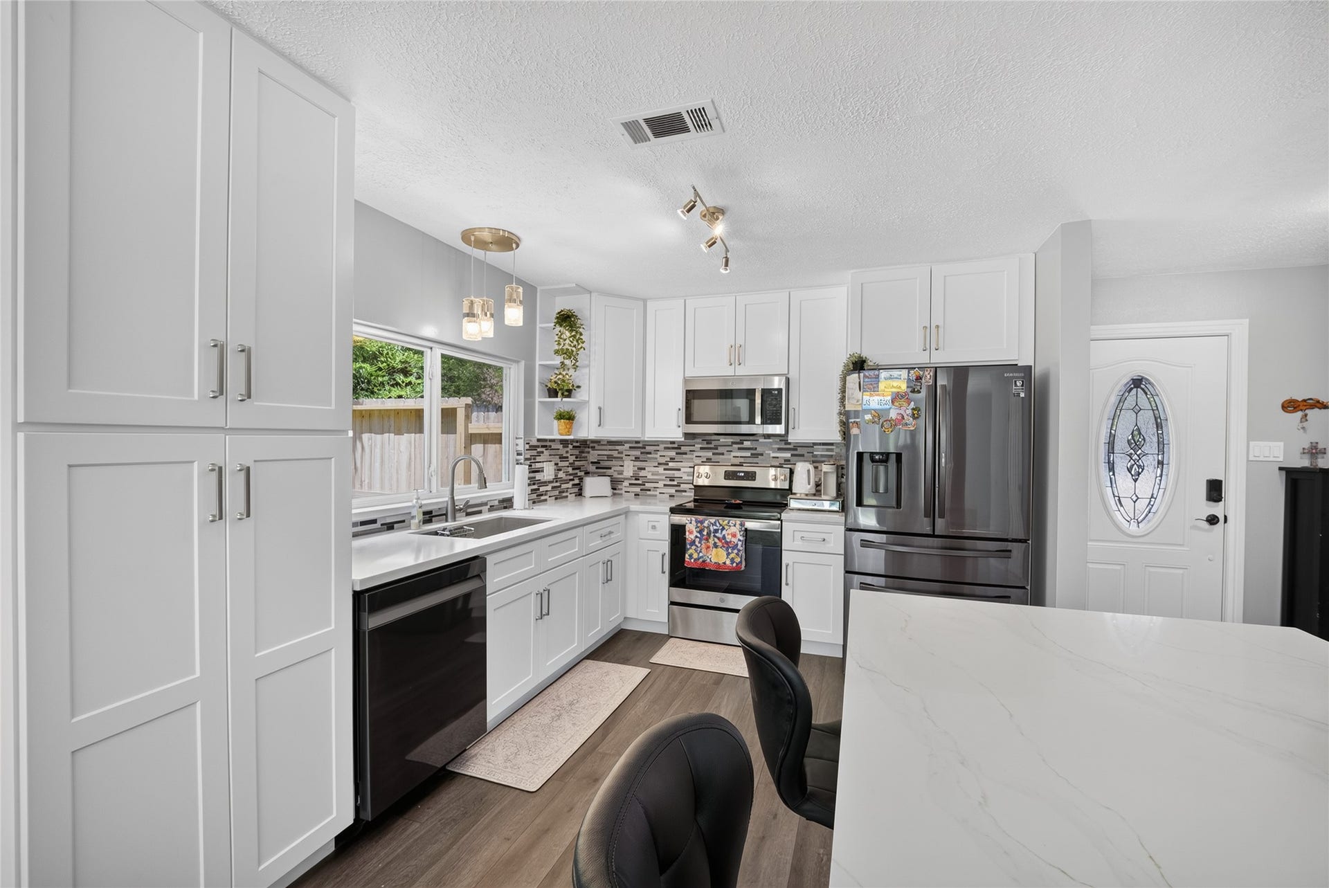 1610 N Red Cedar Circle, The Woodlands, TX 77380 View of kitchen from the living room