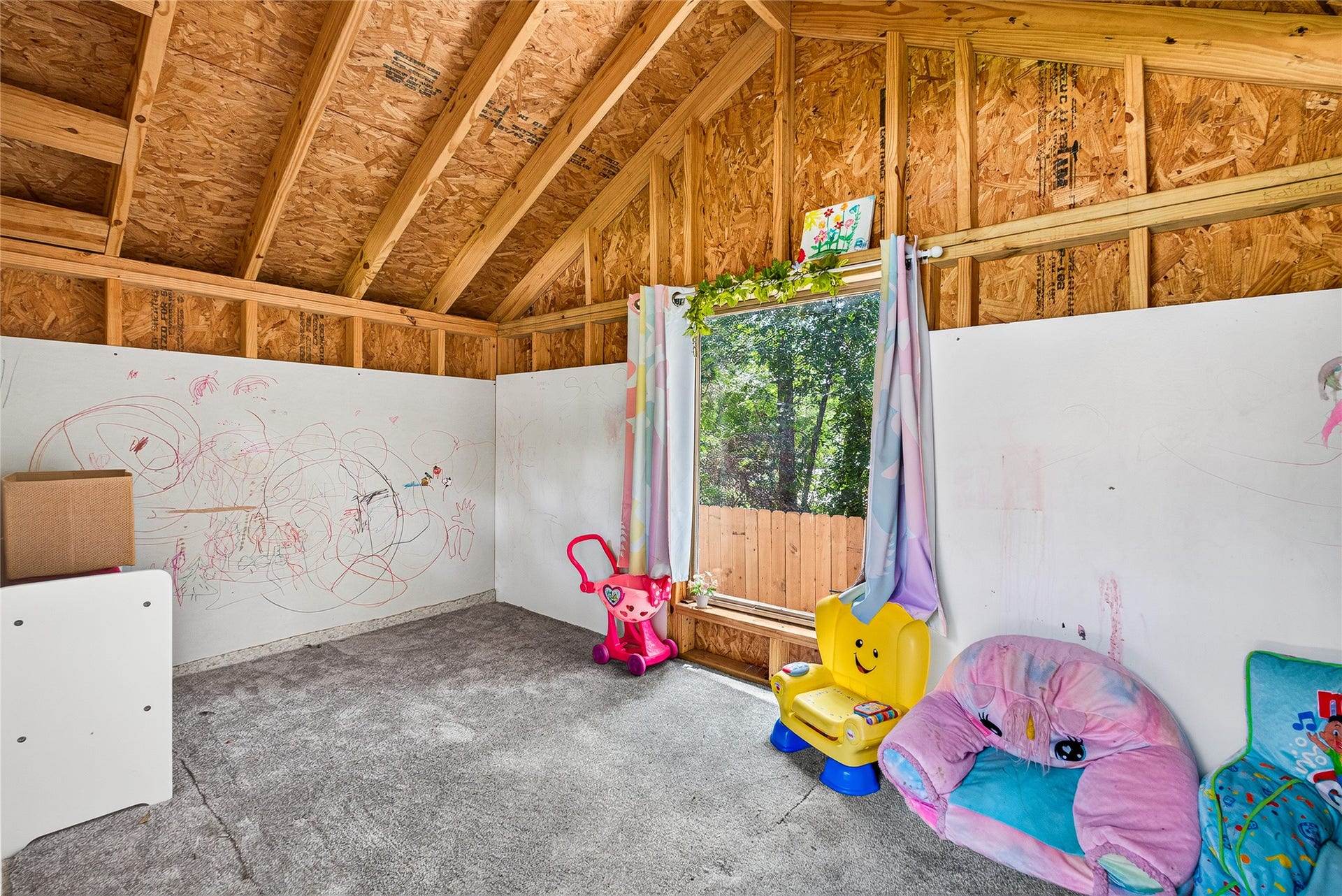 1610 N Red Cedar Circle, The Woodlands, TX 77380 Inside the playhouse - can also be used for extra storage space