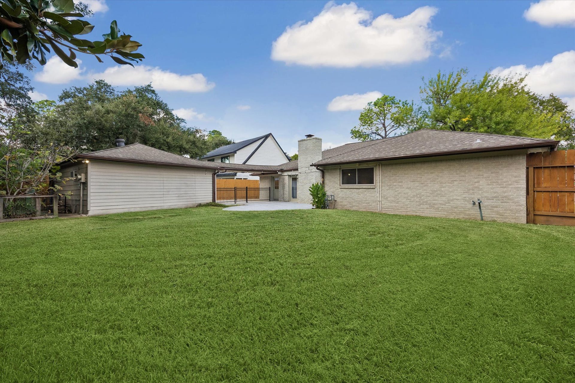 10831 Olympia Drive, Houston, TX 77042 The oversized backyard provides a deep stretch of green space with plenty of room to customize the footprint to your liking!