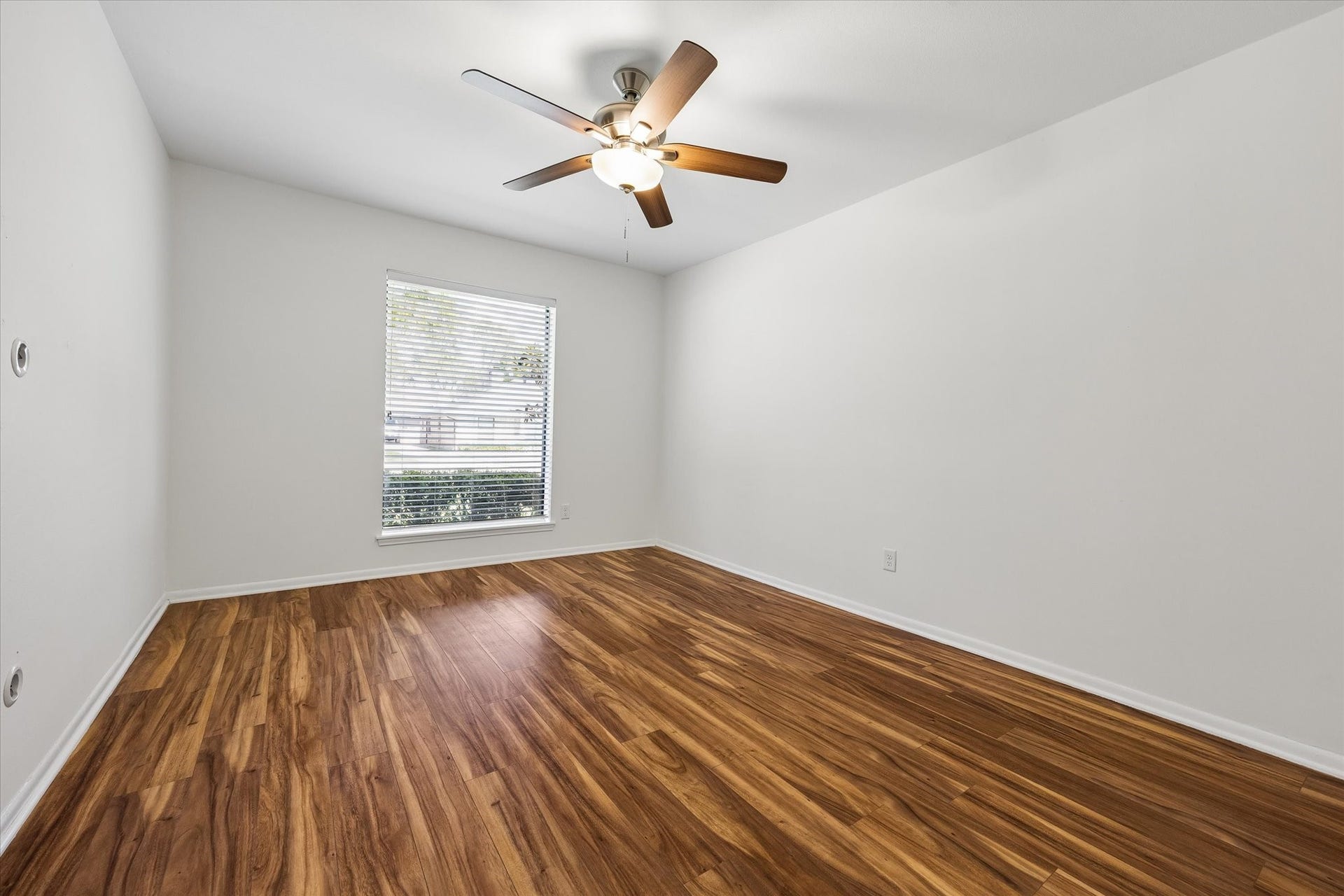 10831 Olympia Drive, Houston, TX 77042 One of three guest bedrooms with great closet space and ceiling fan.