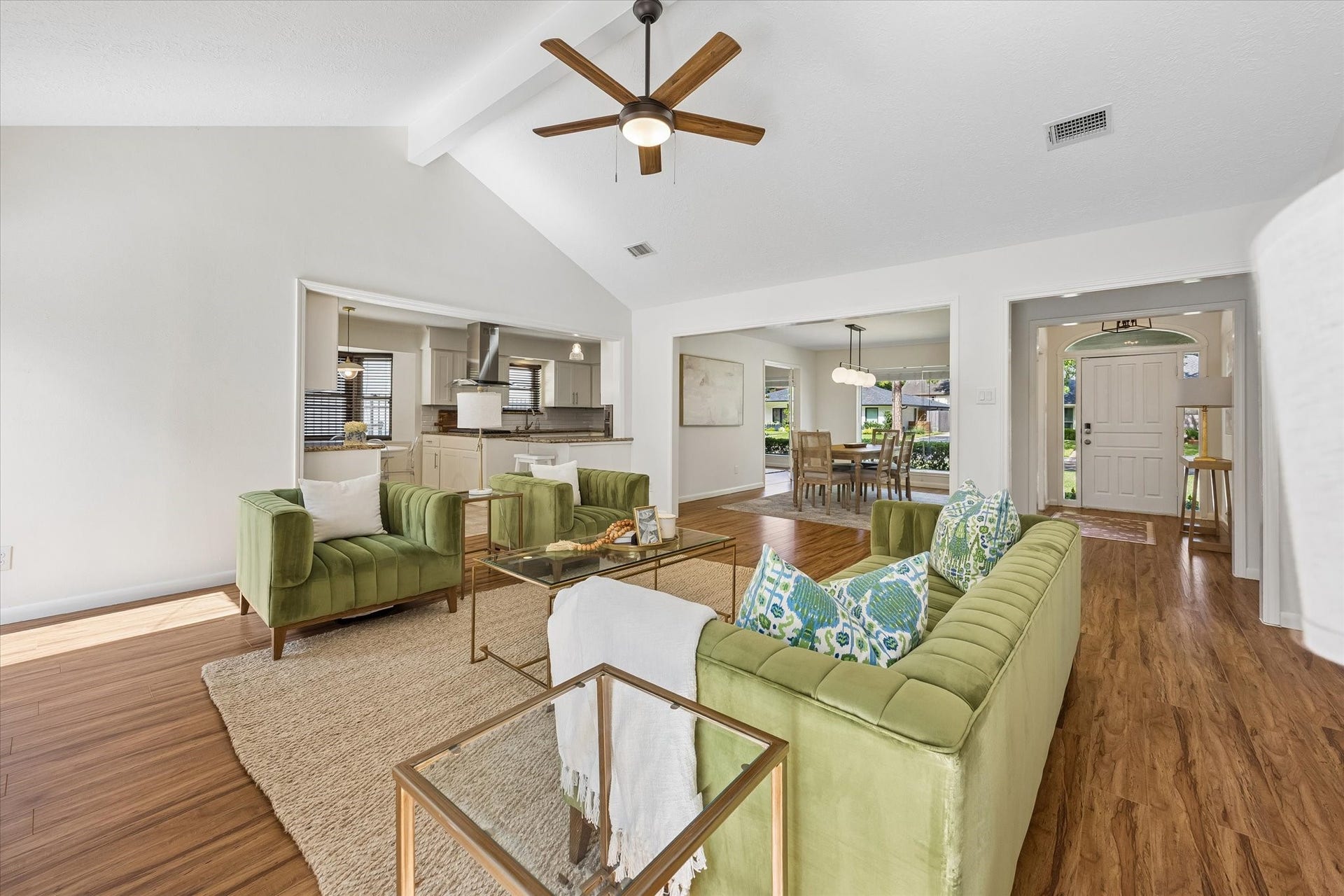 10831 Olympia Drive, Houston, TX 77042 This perspective highlights the homes effortless layout, where the expansive main living area transitions beautifully into the kitchen, breakfast room, and formal dining space.