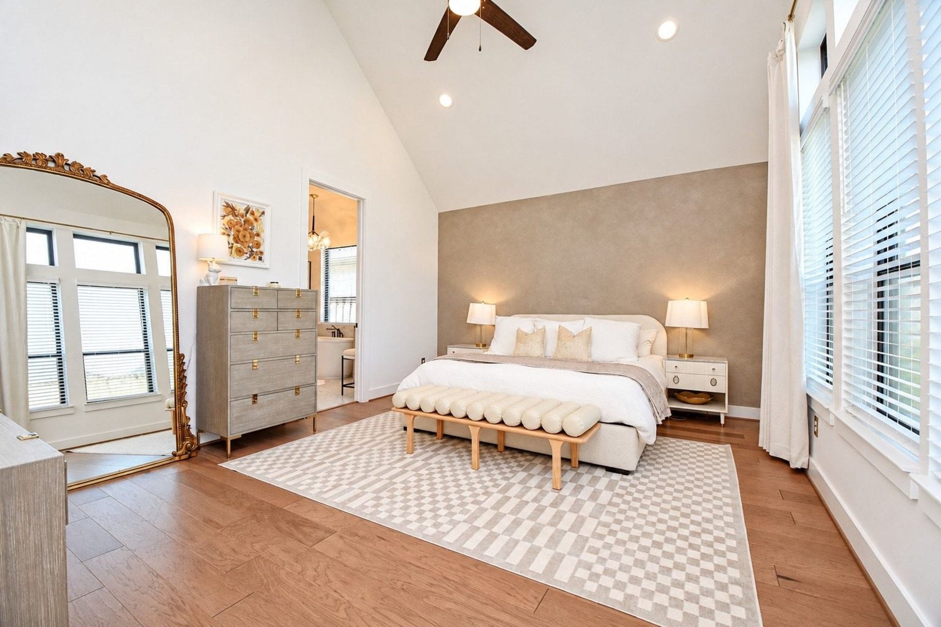 20222 Palomar Pointe Drive, Cypress, TX 77433 Spacious and serene bedroom featuring a vaulted ceiling, large windows with abundant natural light, and a cozy, modern design with soft neutral tones.
