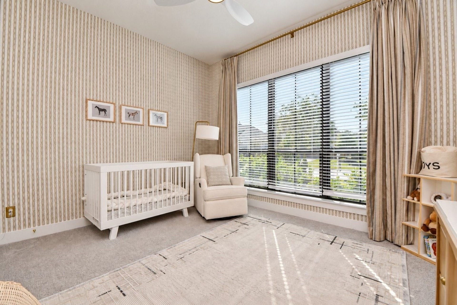 20222 Palomar Pointe Drive, Cypress, TX 77433 Accented with neutral striped wallpaper and large windows that flood the room with natural light. Built-in custom shelves.