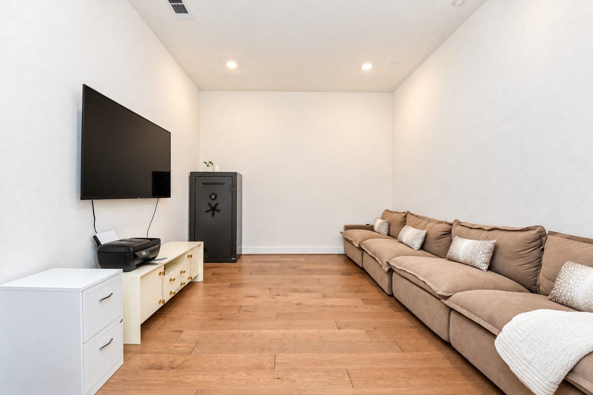 20222 Palomar Pointe Drive, Cypress, TX 77433 Cozy media room with hardwood flooring, perfect for relaxing and entertainment.