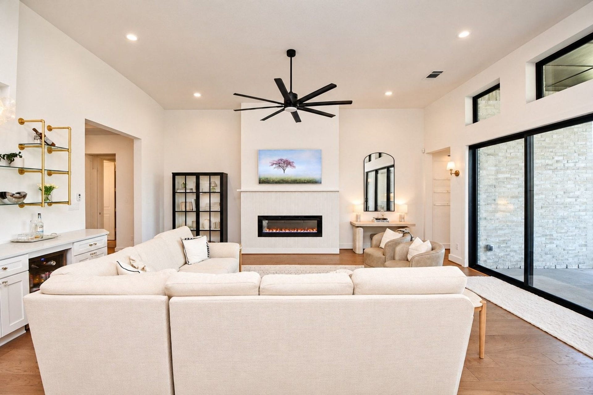 20222 Palomar Pointe Drive, Cypress, TX 77433 Spacious living room with high ceilings, featuring large sliding glass doors that flood the space with natural light.