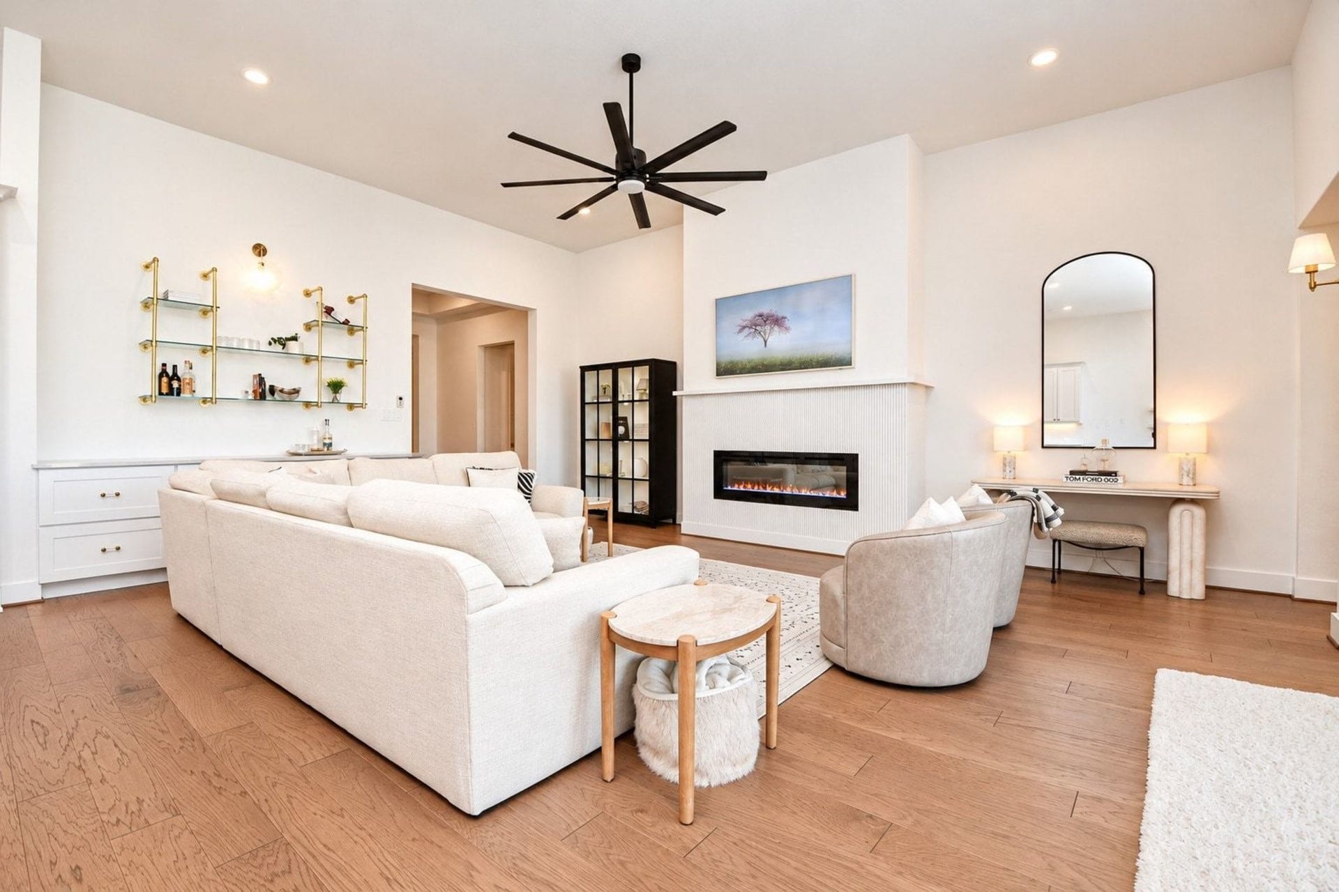 20222 Palomar Pointe Drive, Cypress, TX 77433 Elegant living room featuring a sleek modern fireplace with gorgeous fluted tile. The fireplace is electric and be used year round.