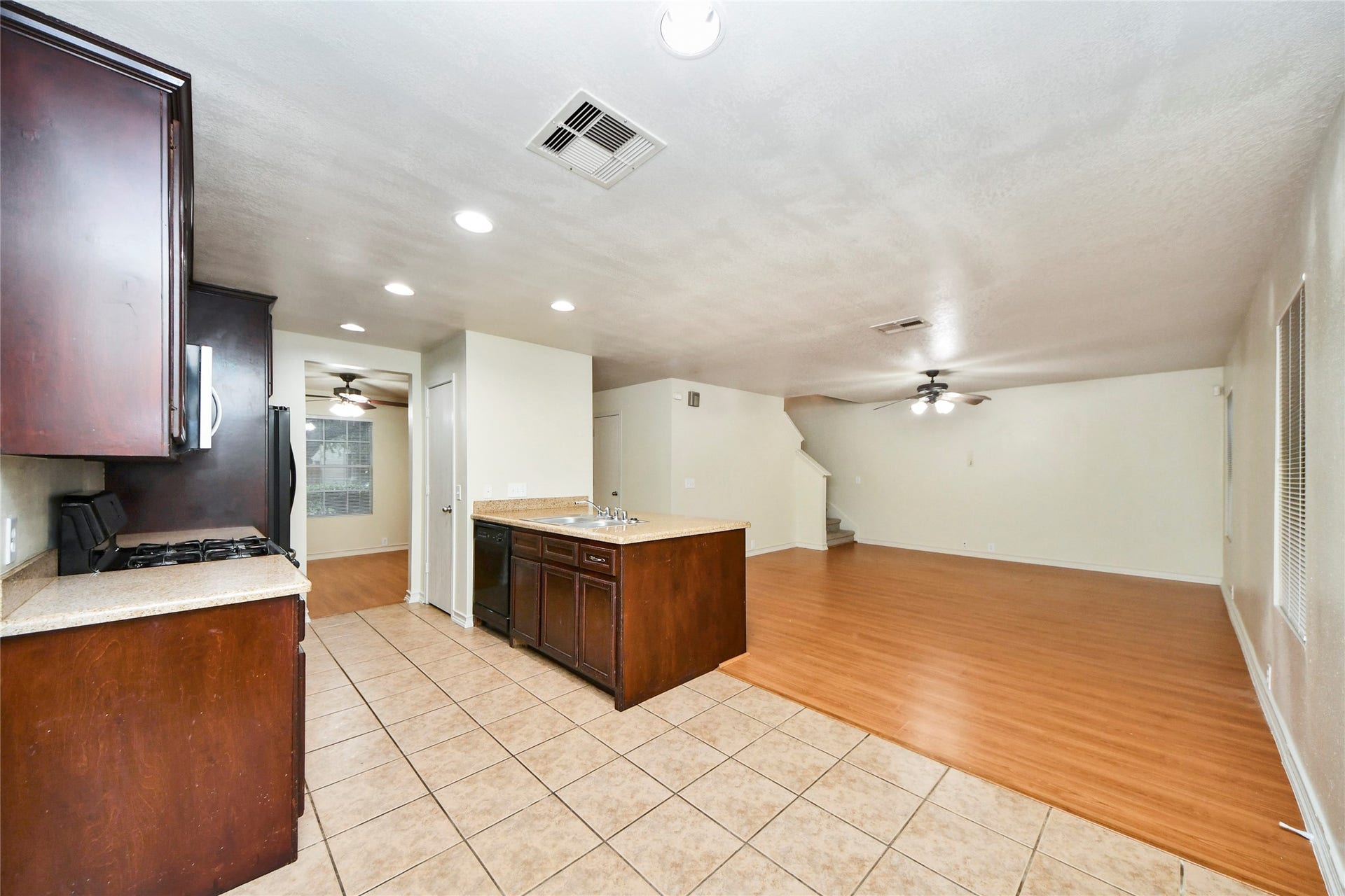 Enjoy seamless living and entertaining with a kitchen that flows effortlessly into the spacious family room, creating a warm and inviting atmosphere.