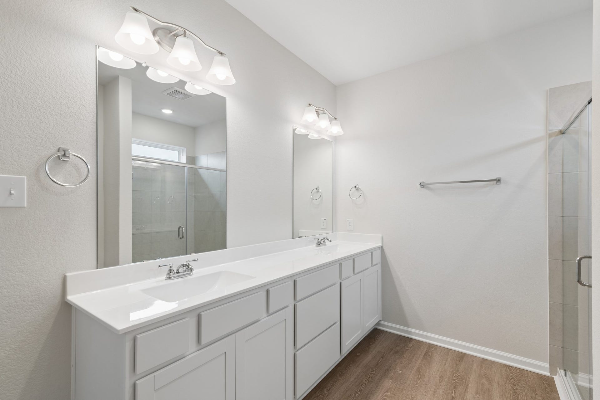 2518 Outpost Canyon Drive, Iowa Colony, TX 77583 The Oakshire II- Primary Bathroom with Dual Vanities and Walk-In Shower. Sample image for illustration; upgrades, options, and colors may vary.