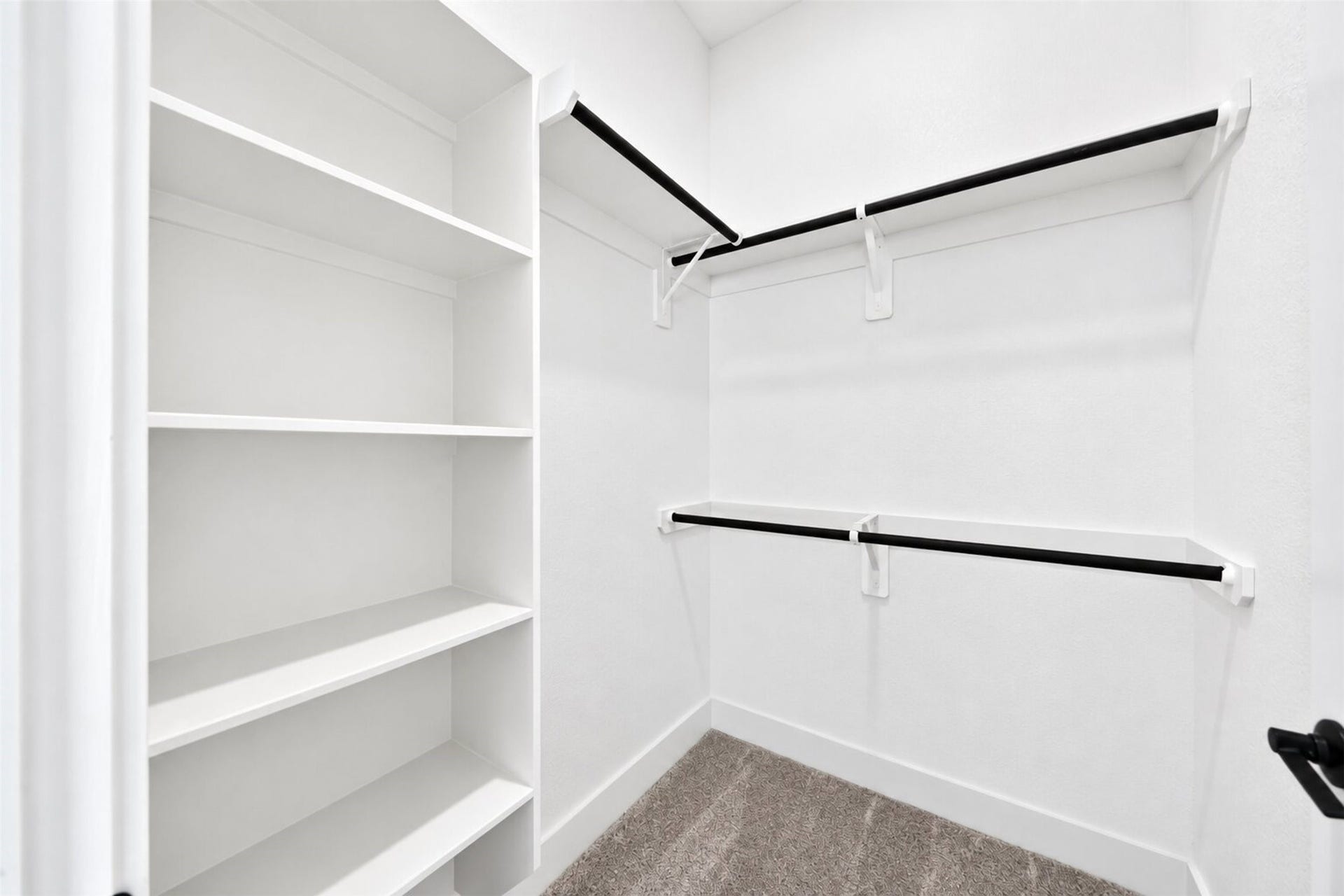 32506 Ebony Jewelwing Court, Fulshear, TX 77441 Secondary Walk-In Closet
Generously sized secondary walk-in closet featuring built-in shelving and dual-level hanging space, providing excellent storage and organization.