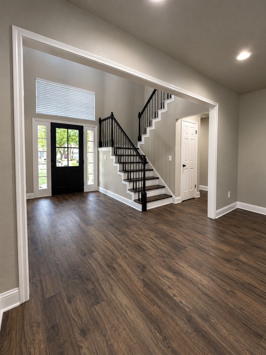 2102 Autumn Cove Drive, League City, TX 77573 View from the living room highlighting the beautiful entryway, elegant staircase, and open floor plan.