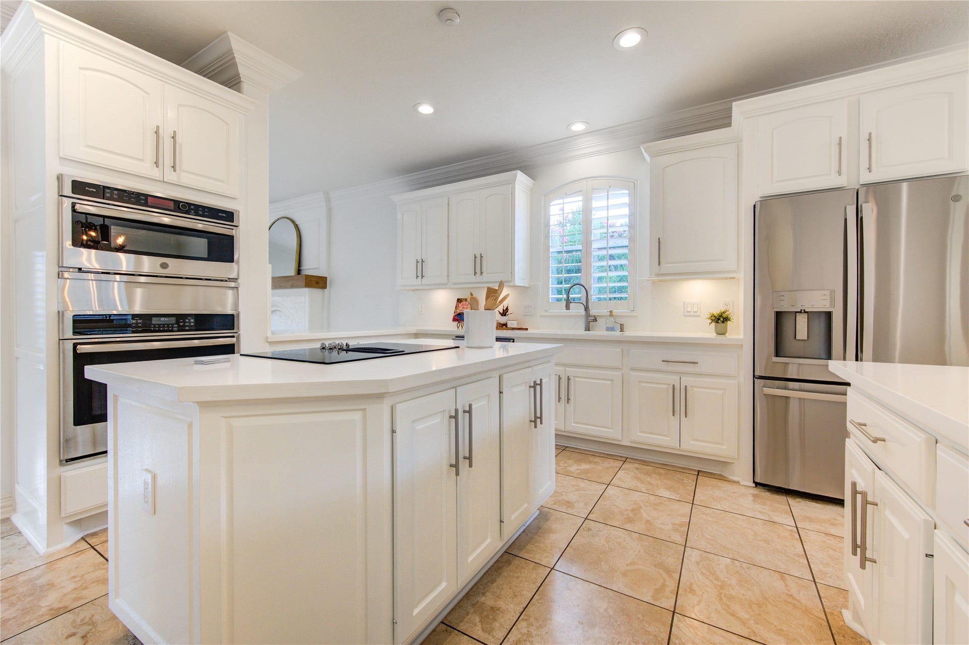 14114 Barnhart Boulevard, Houston, TX 77077 Stunning open-concept kitchen with updated appliances, ample cabinet storage, and views overlooking the gathering and breakfast areasperfect for entertaining.