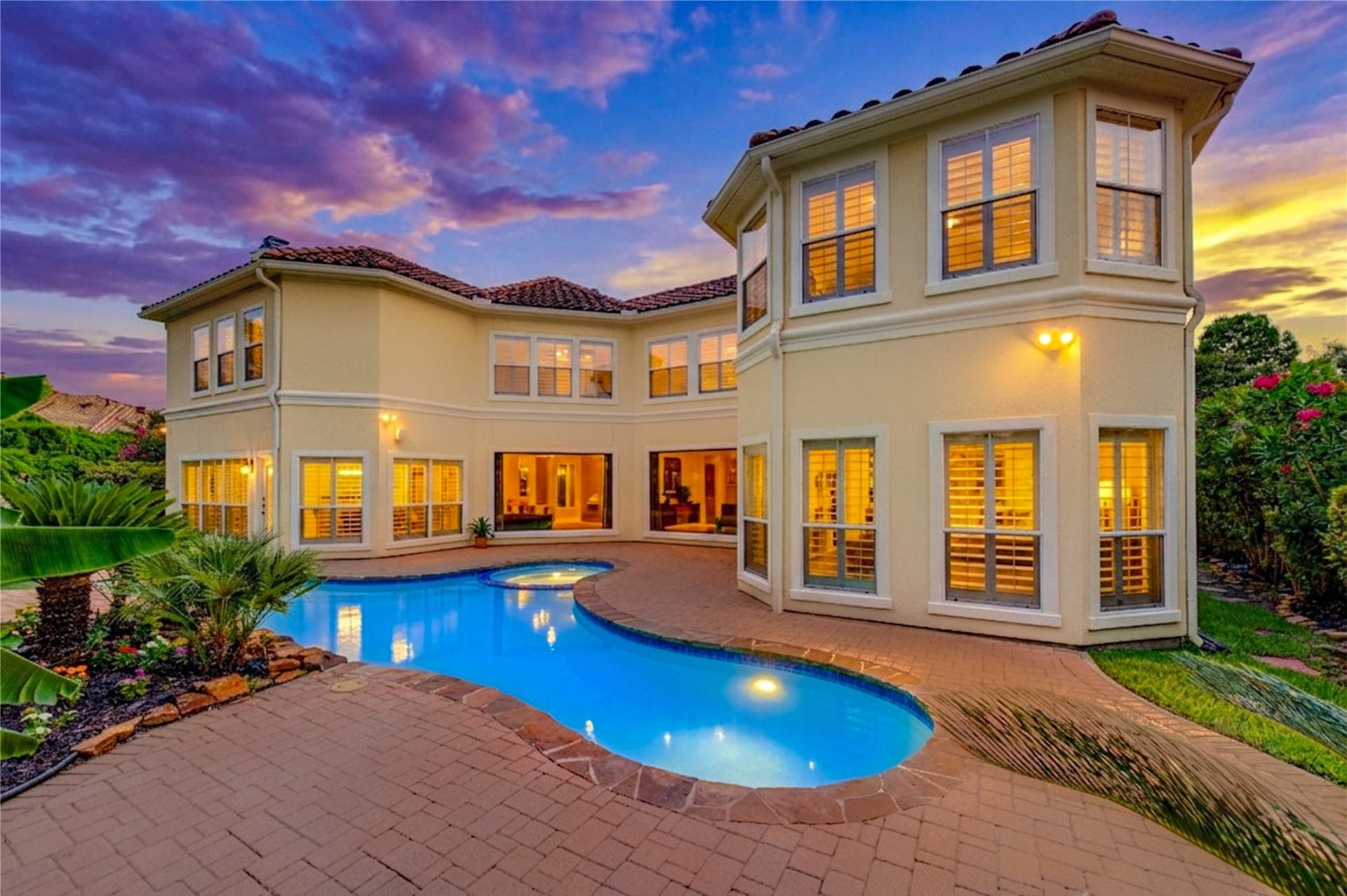 14114 Barnhart Boulevard, Houston, TX 77077 Private oasis featuring a gated entrance, spacious yard, and pool ideal for entertaining and hosting events.