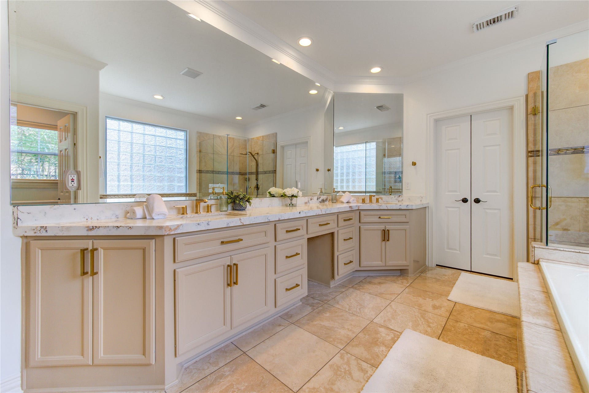 14114 Barnhart Boulevard, Houston, TX 77077 Beautifully renovated primary bathroom featuring a custom shower, updated hardware, and brand-new countertops.