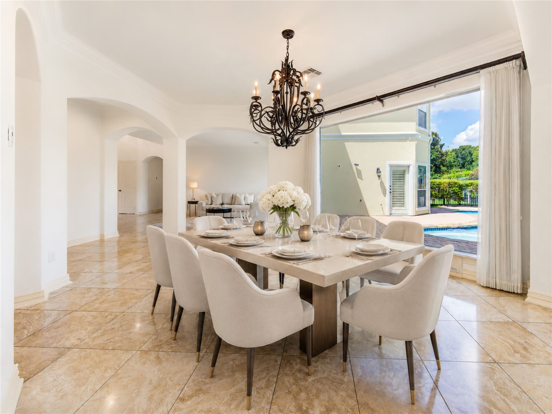 14114 Barnhart Boulevard, Houston, TX 77077 formal dining room with direct view to pool and connecte4d to the gathering area and kitchen centered of the home for next party