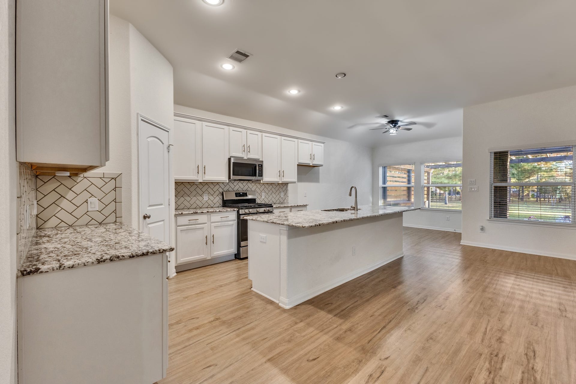 Granite counter tops and soft close cabinets and drawers. Walk-in pantry