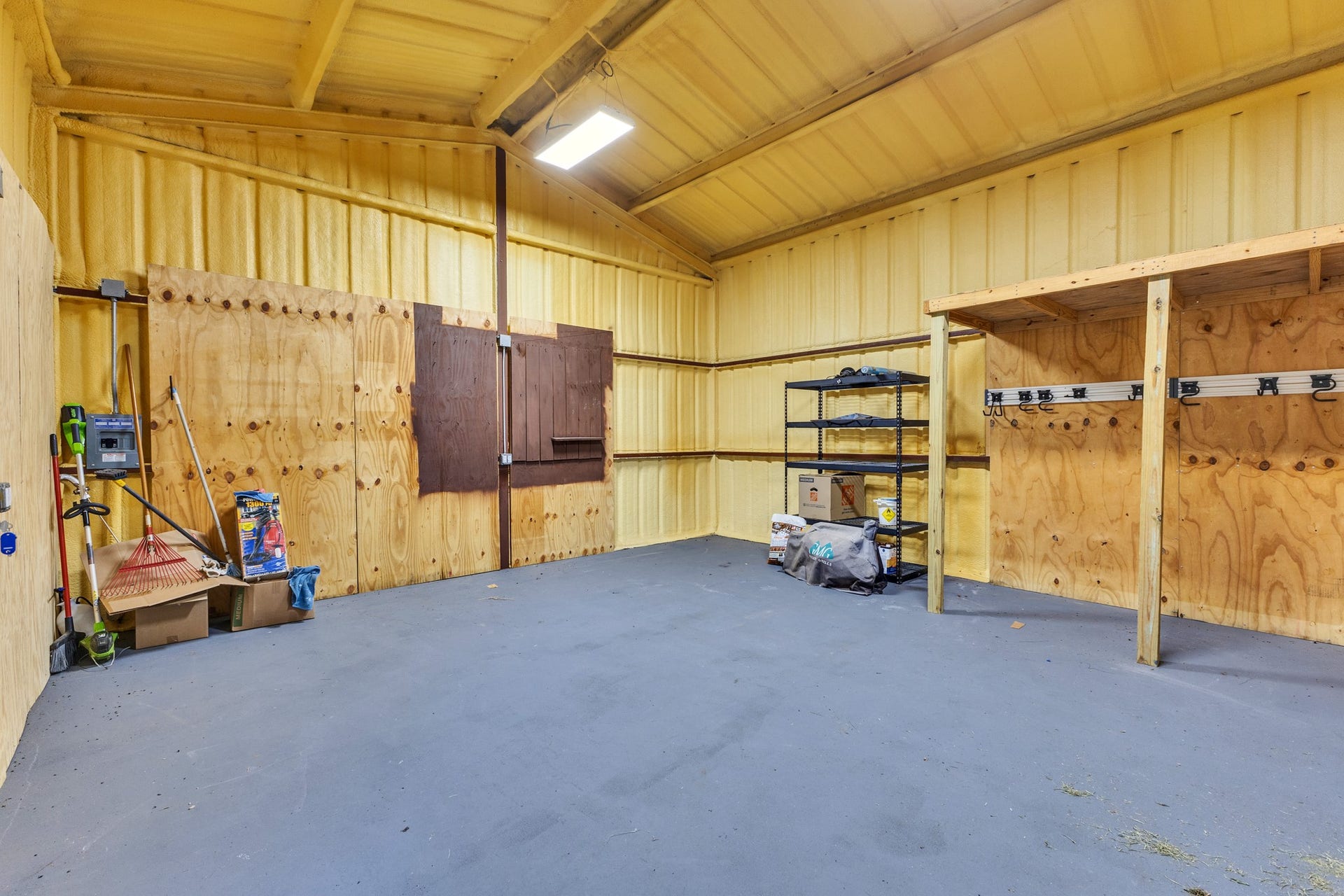 Insulated shop with shelves and electrical