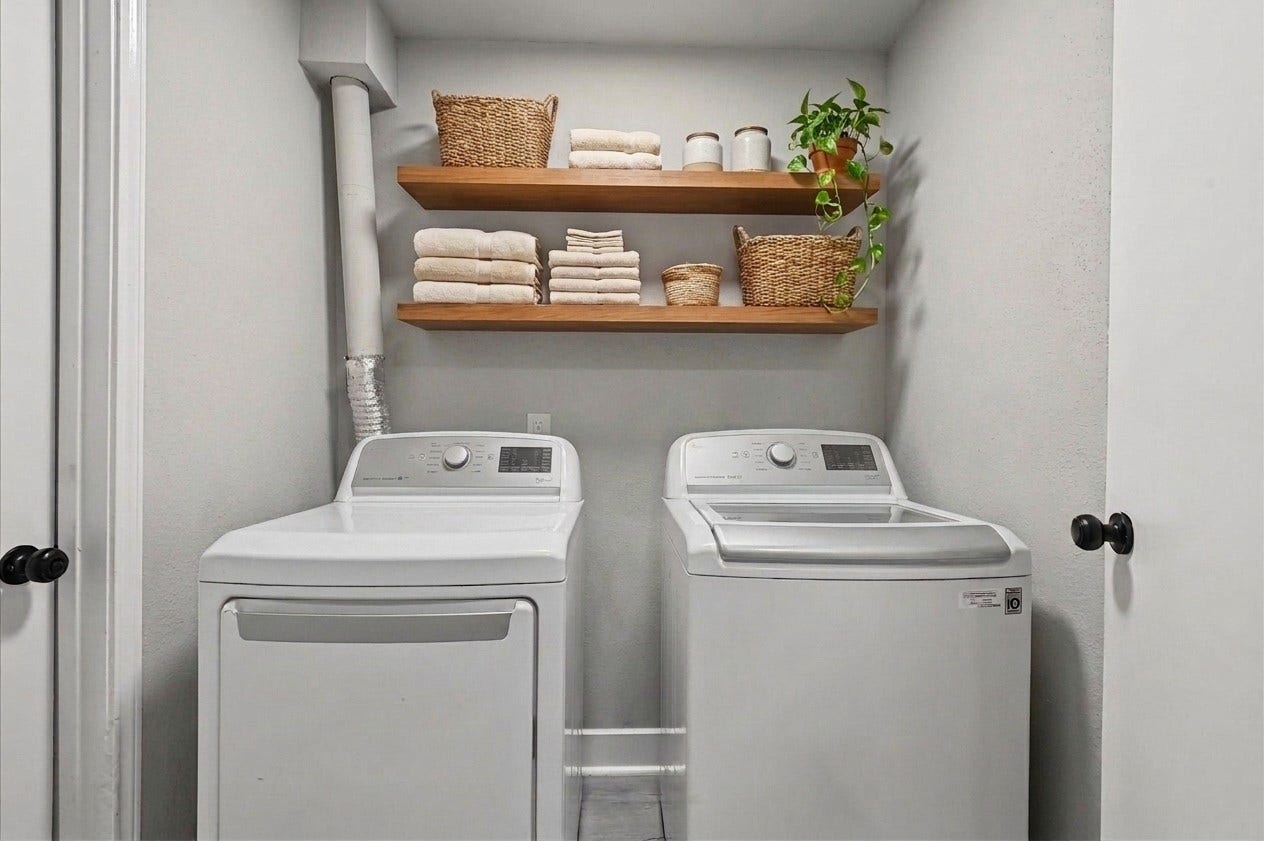 22302 Red River Drive, Katy, TX 77450 laundry wall virtually staged